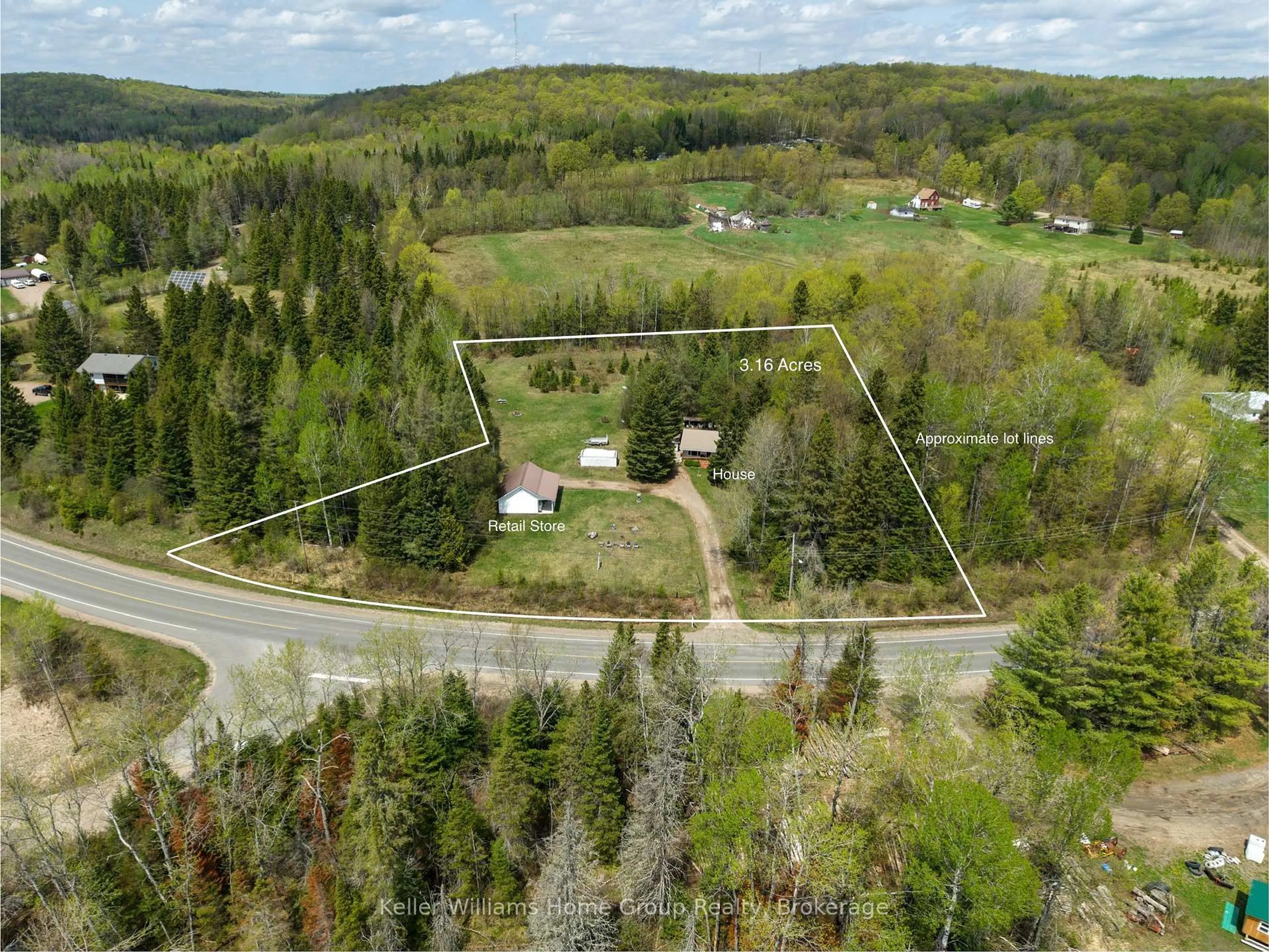 A pic from outside/outdoor area/front of a property/back of a property/a pic from drone, forest/trees view for 5311 Loop Rd, Highlands East Ontario K0L 2A0