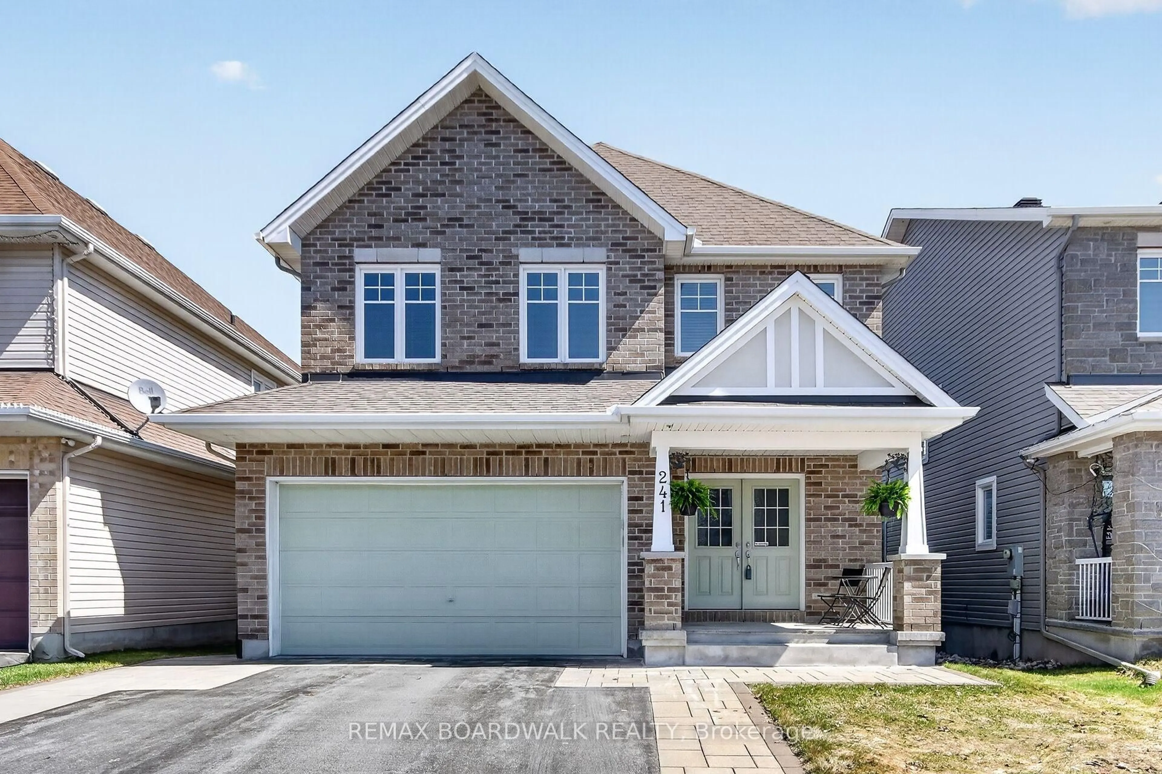 Home with brick exterior material, street for 241 Denali Way, Stittsville Ontario K2S 0N1