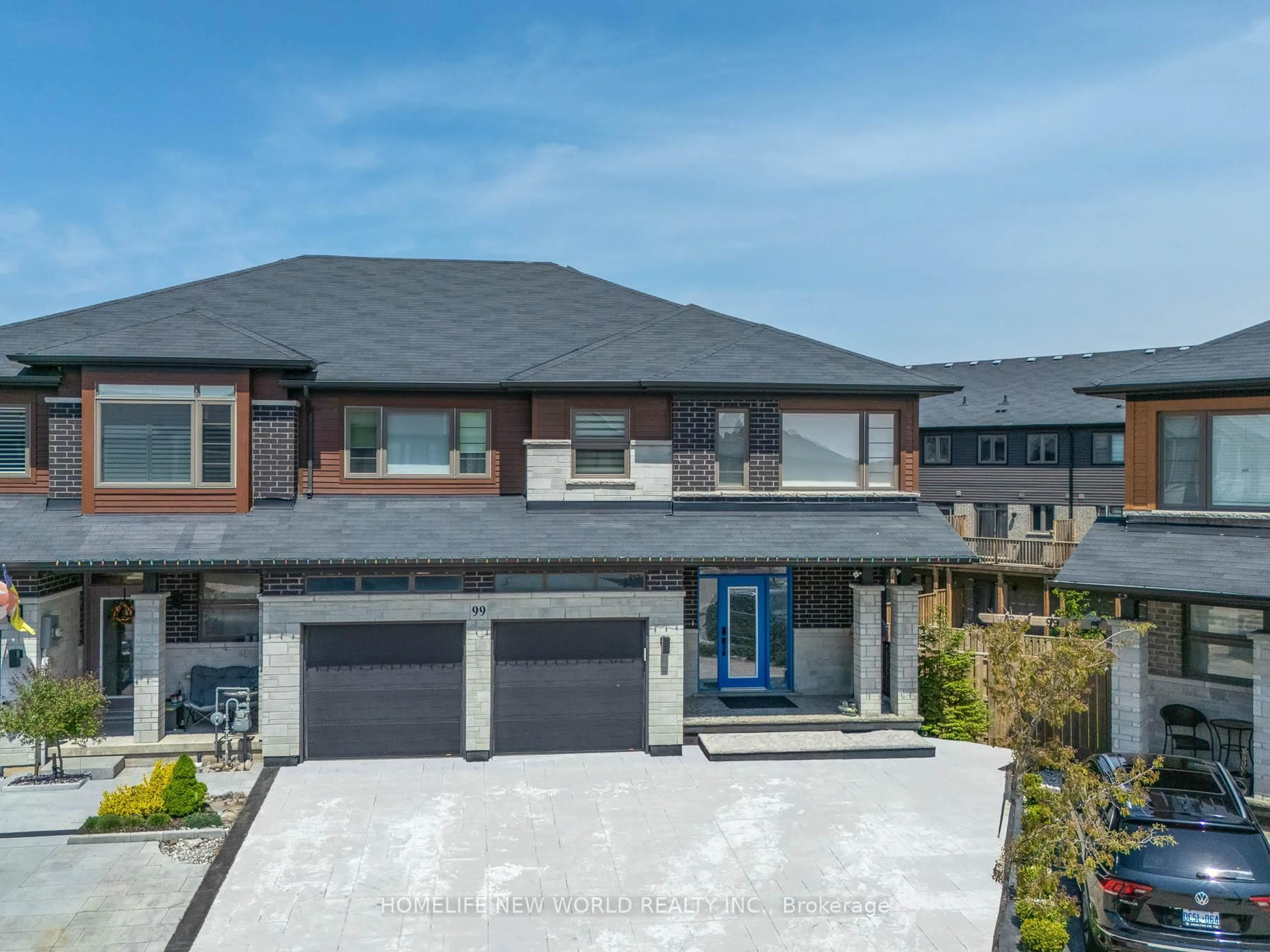 Home with brick exterior material, street for 99 Columbus Gate, Hamilton Ontario L8J 0L3