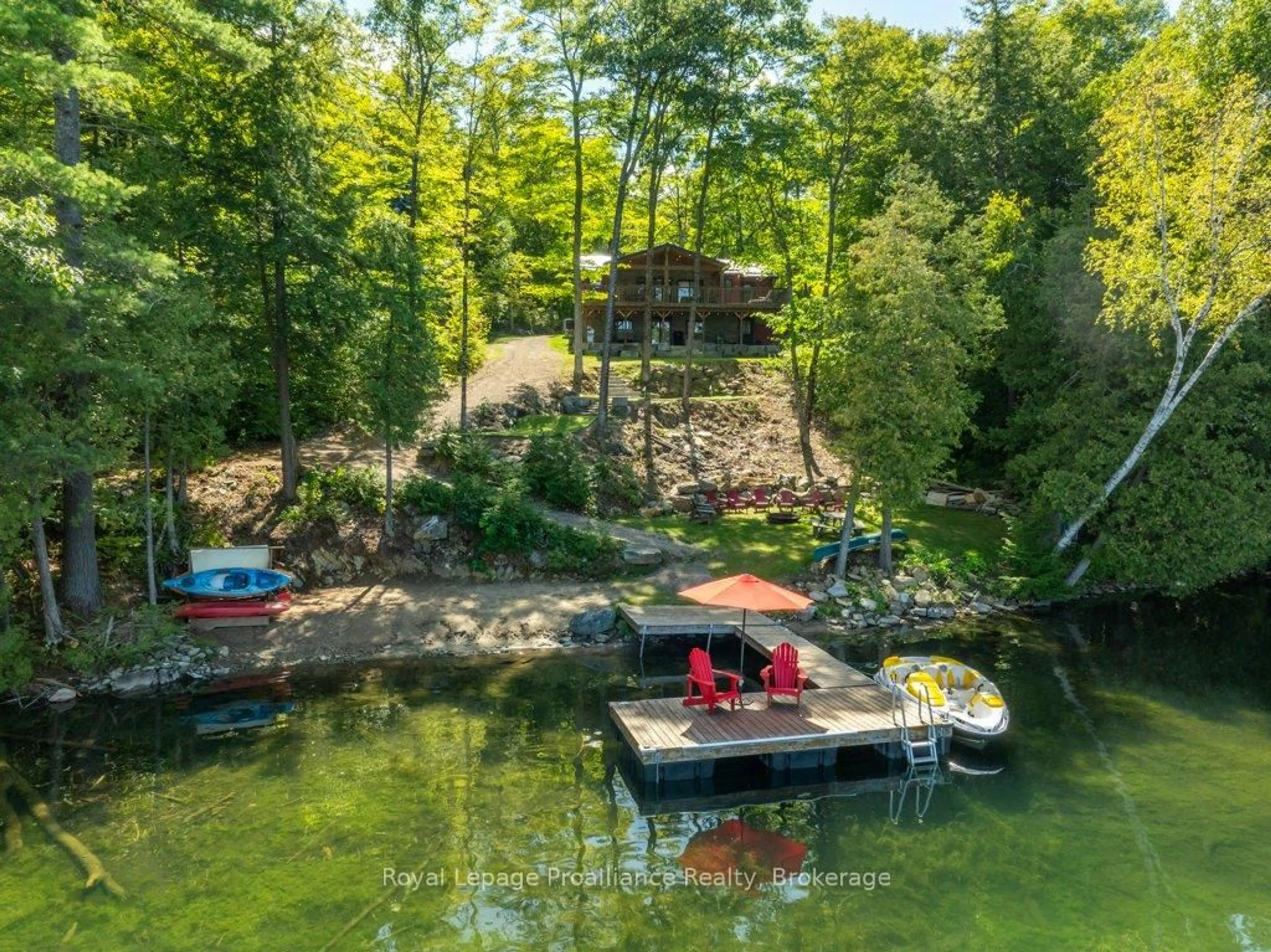 A pic from outside/outdoor area/front of a property/back of a property/a pic from drone, water/lake/river/ocean view for 1202 Rocky Lane Lane, Cloyne Ontario K0H 1K0