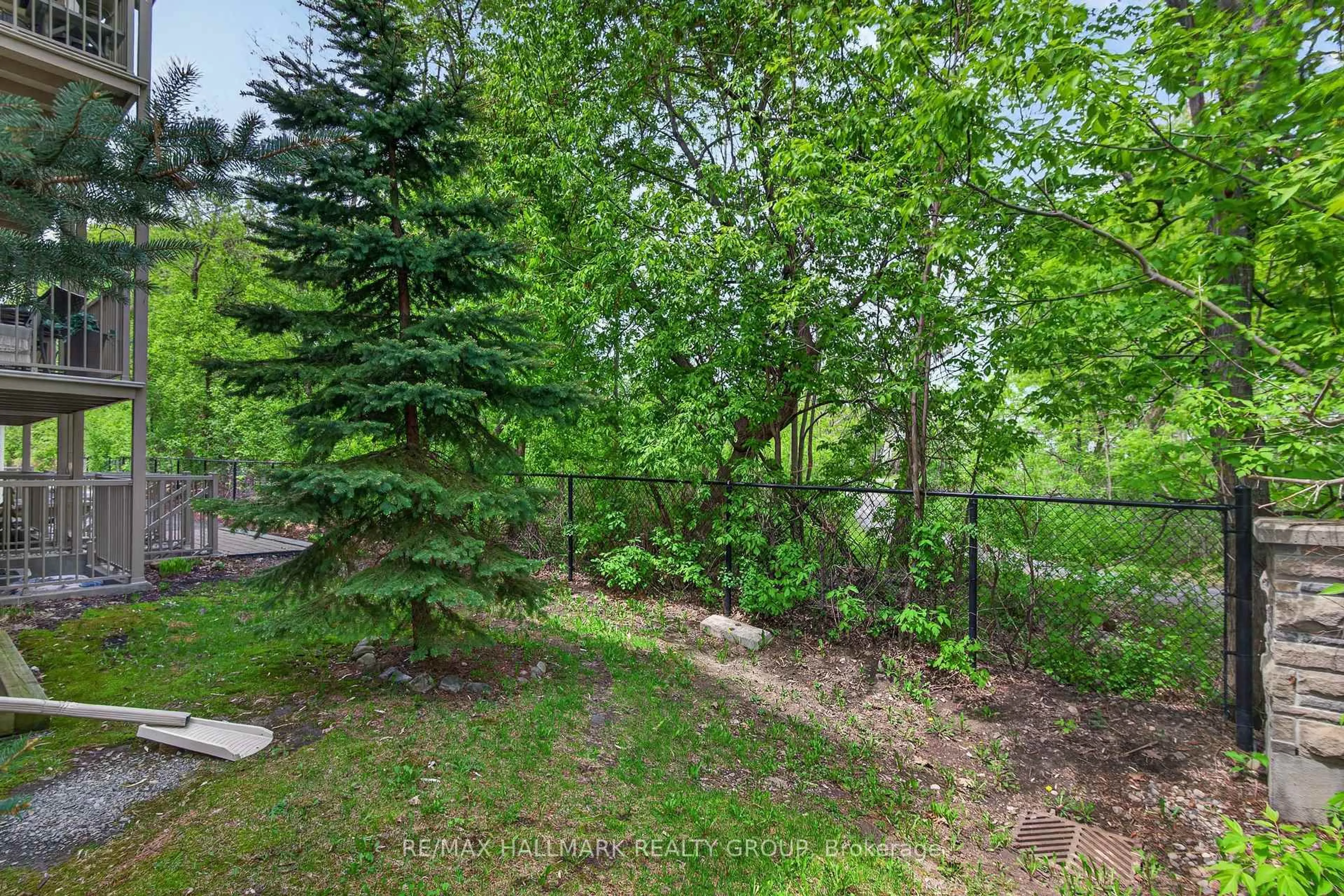 A pic from outside/outdoor area/front of a property/back of a property/a pic from drone, forest/trees view for 15 Tadley Private #14, Ottawa Ontario K2J 2T3