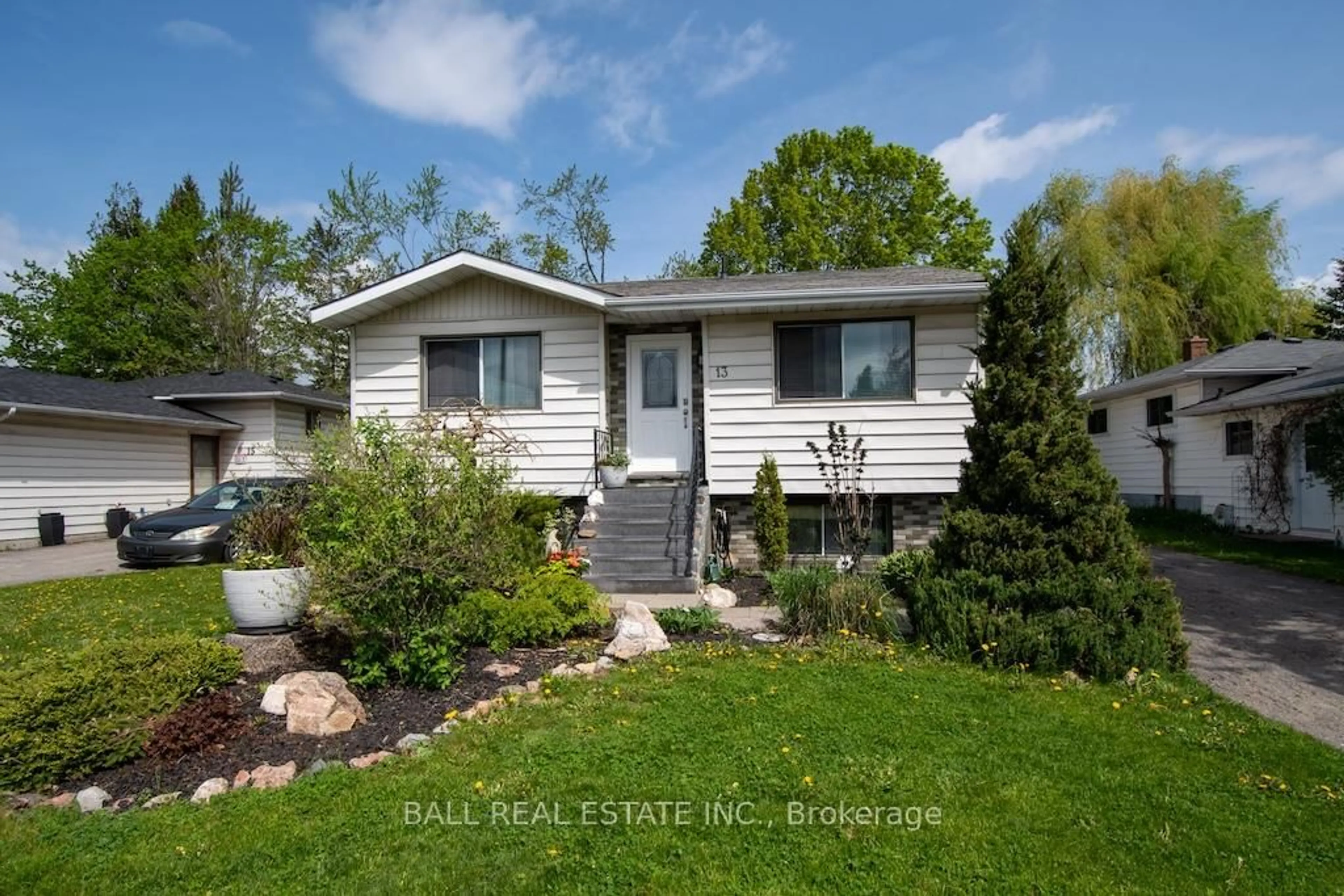Home with vinyl exterior material, street for 13 Coyle Cres, Selwyn Ontario K0L 2H0