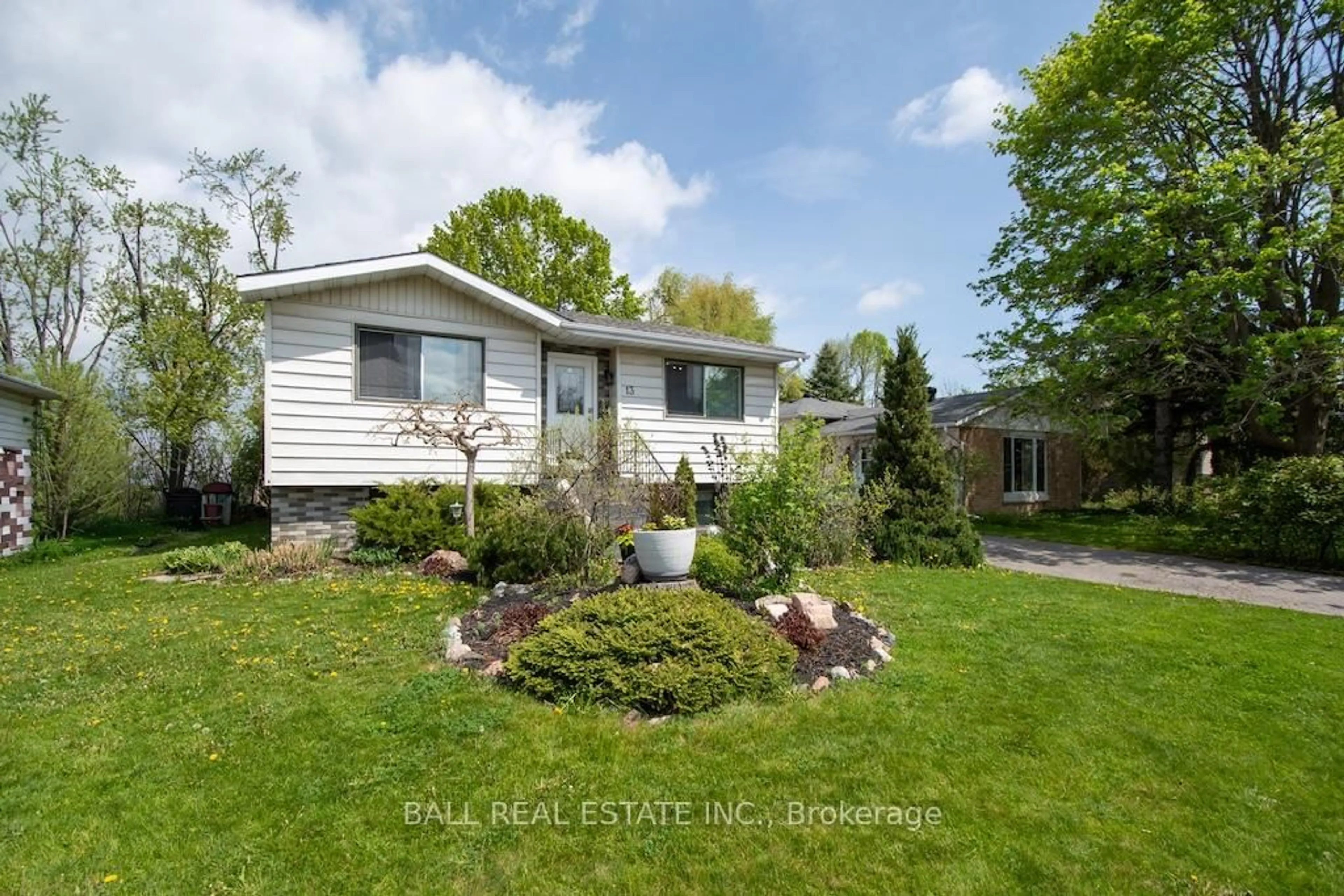 Home with vinyl exterior material, street for 13 Coyle Cres, Selwyn Ontario K0L 2H0