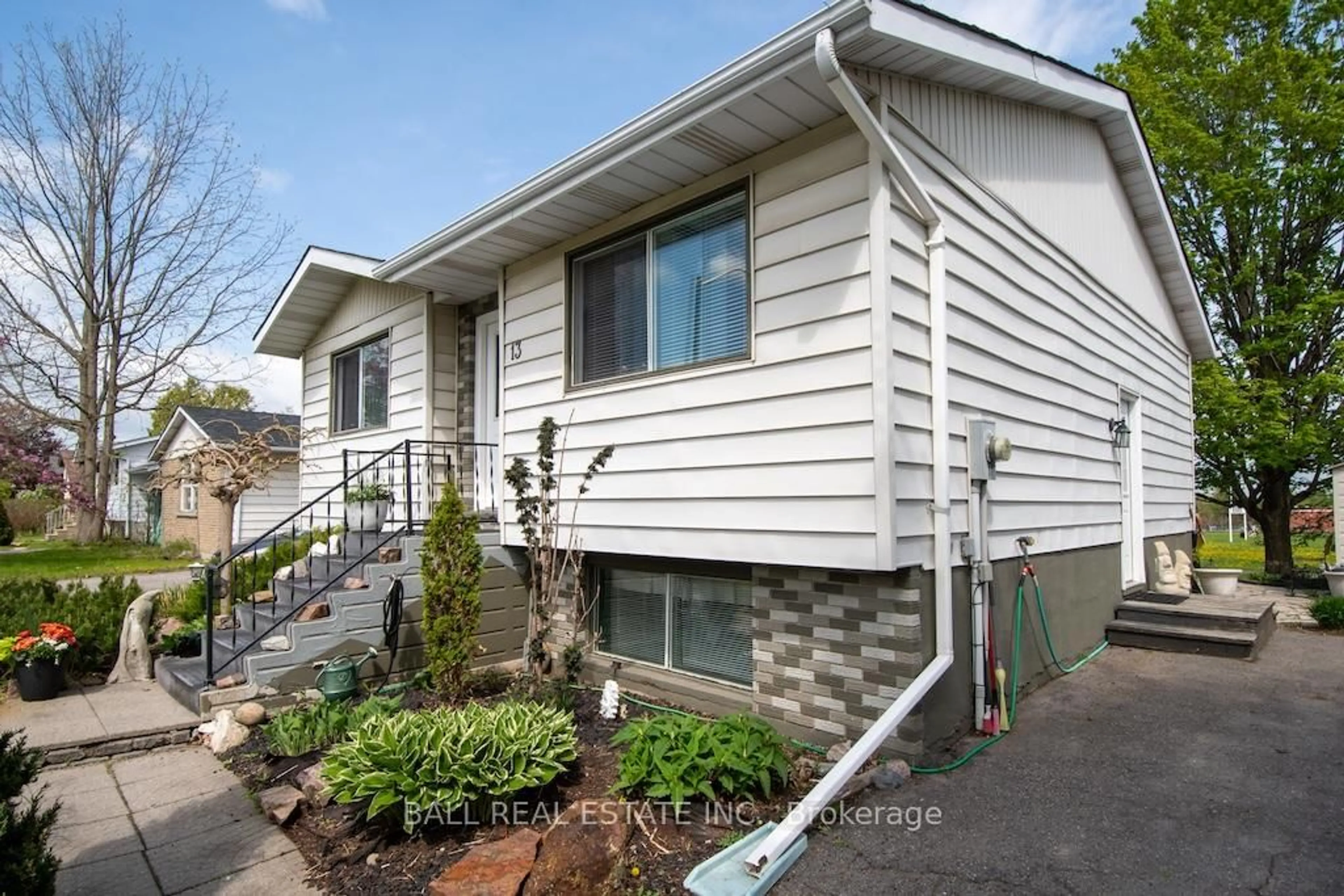 Home with vinyl exterior material, street for 13 Coyle Cres, Selwyn Ontario K0L 2H0