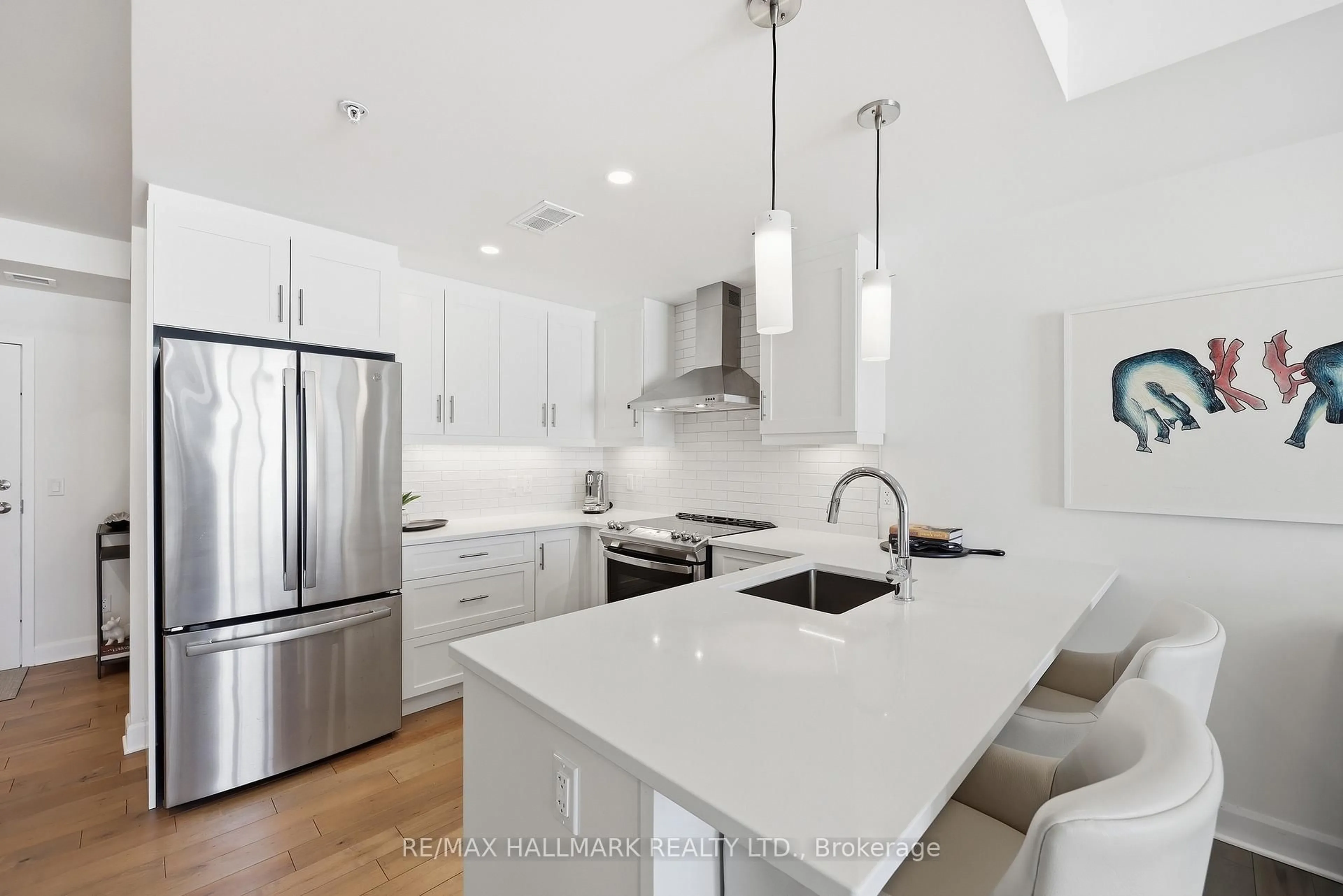 Open concept kitchen, ceramic/tile floor for 129b South St #318, Gananoque Ontario K7G 0B1
