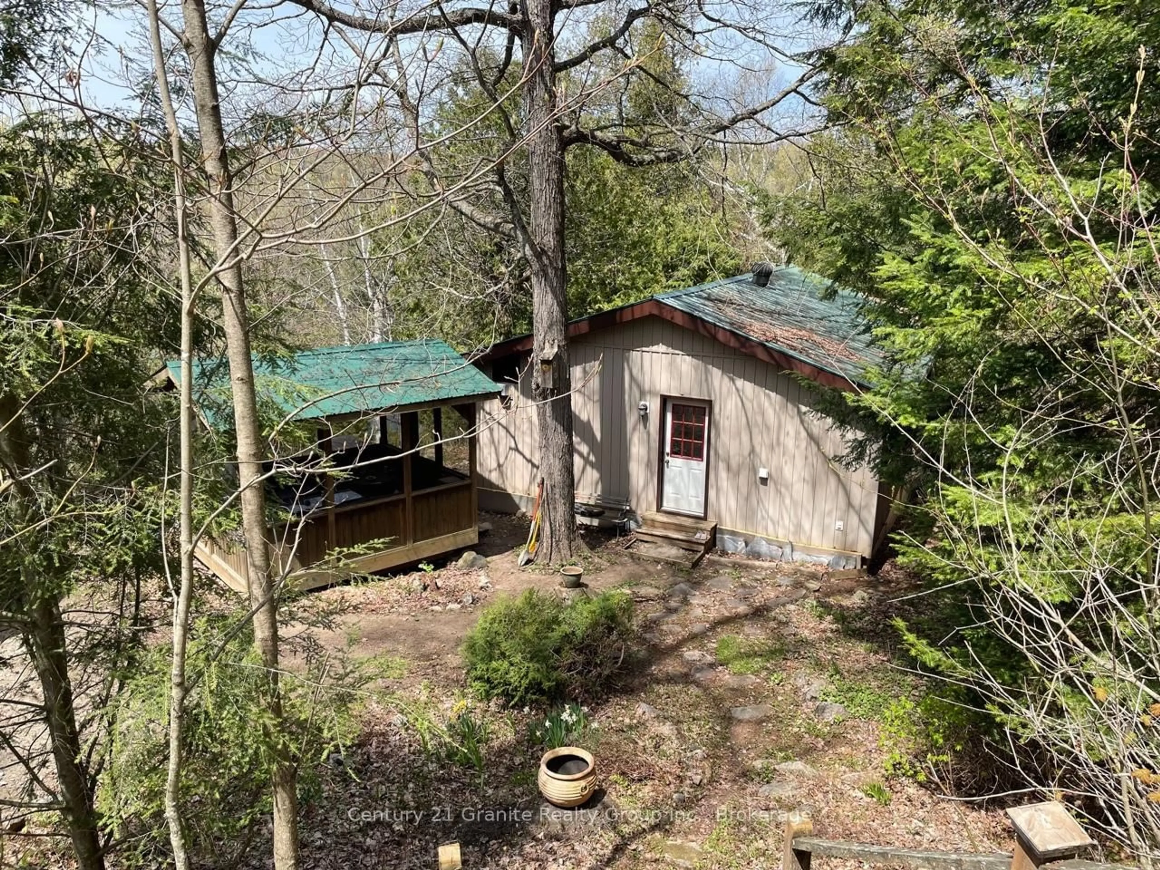 A pic from outside/outdoor area/front of a property/back of a property/a pic from drone, forest/trees view for 1167 Precipice Rd, Dysart et al Ontario K0M 1S0