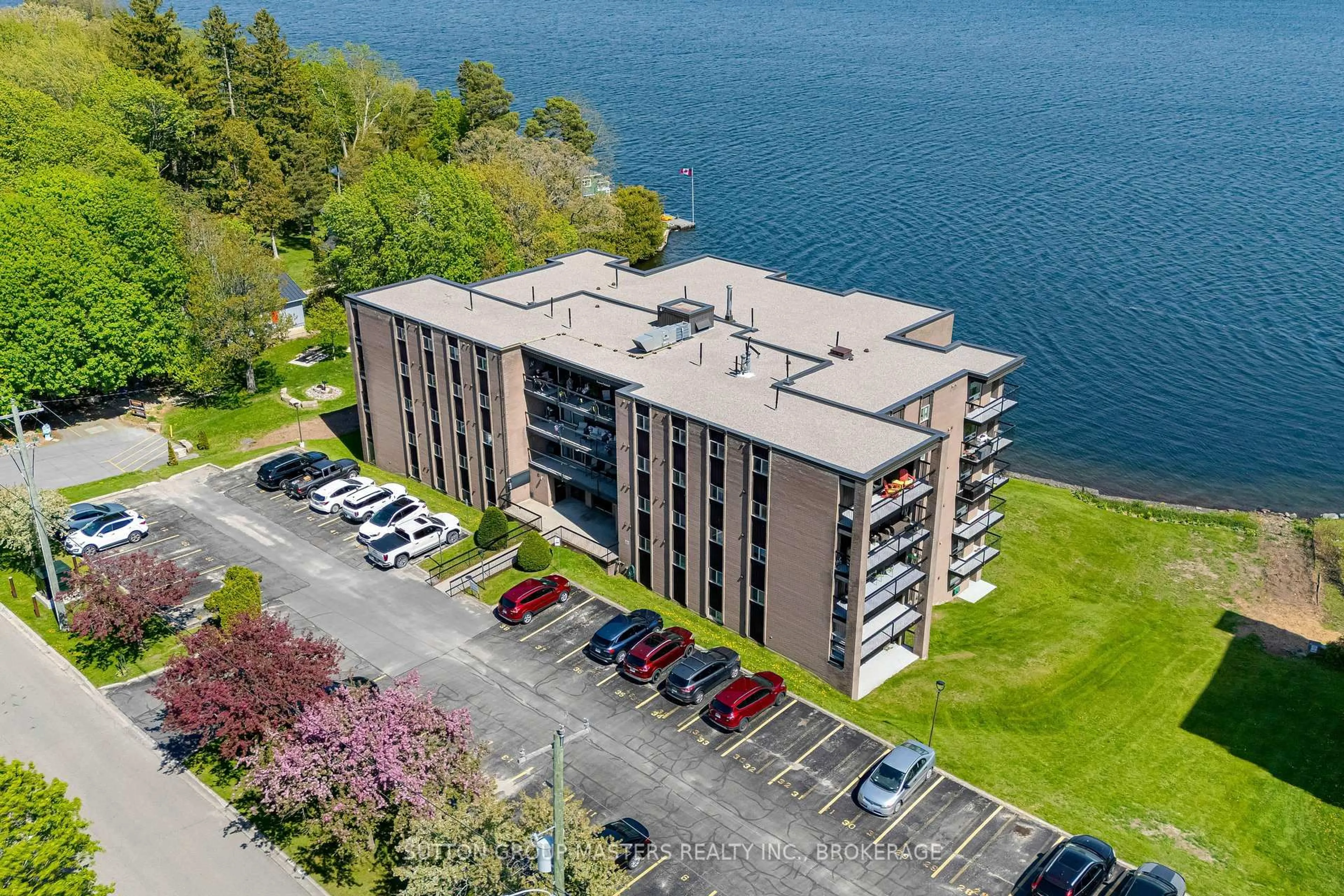 A pic from outside/outdoor area/front of a property/back of a property/a pic from drone, water/lake/river/ocean view for 610 William Street South #302, Gananoque Ontario K7G 3A4