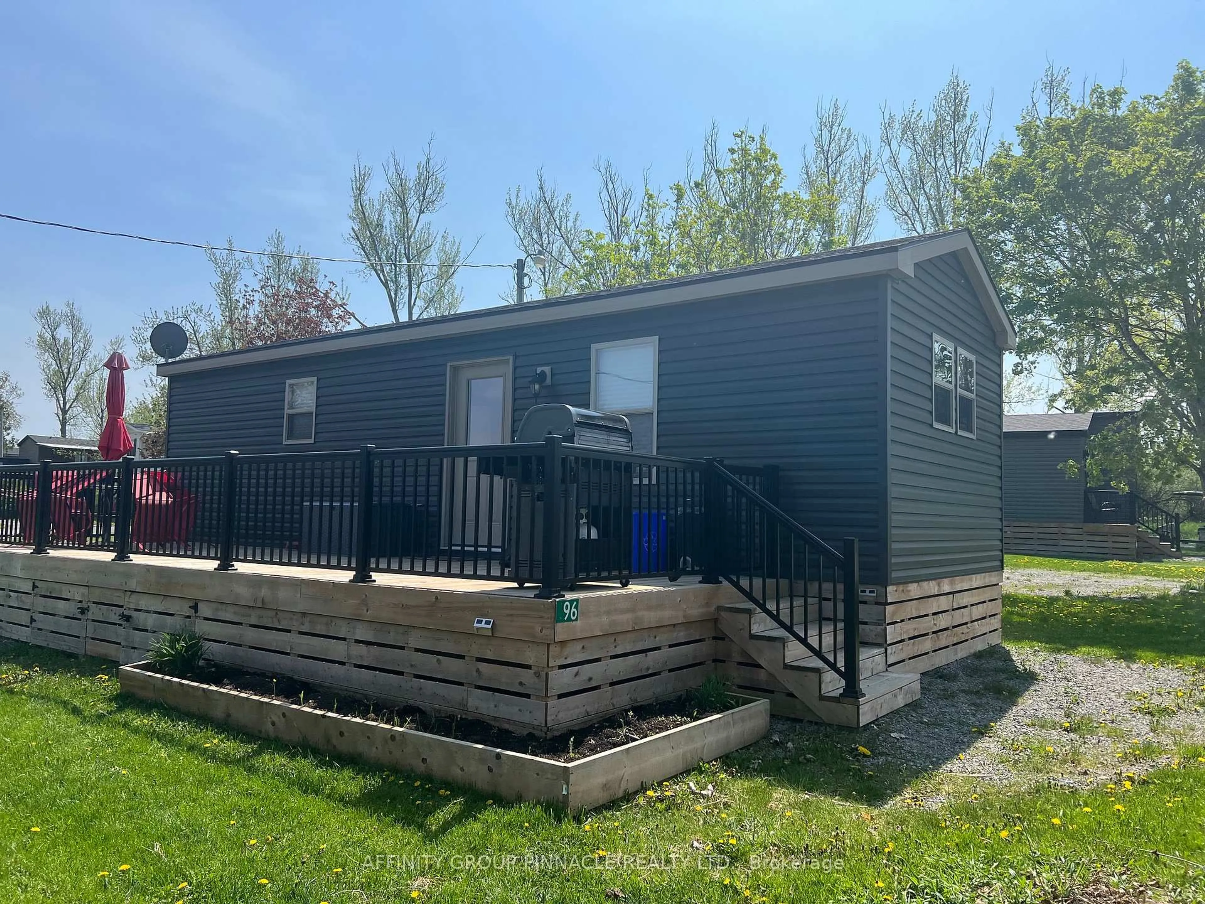 Home with vinyl exterior material, street for 657 THUNDER BRIDGE Rd #96, Kawartha Lakes Ontario K9V 4R1