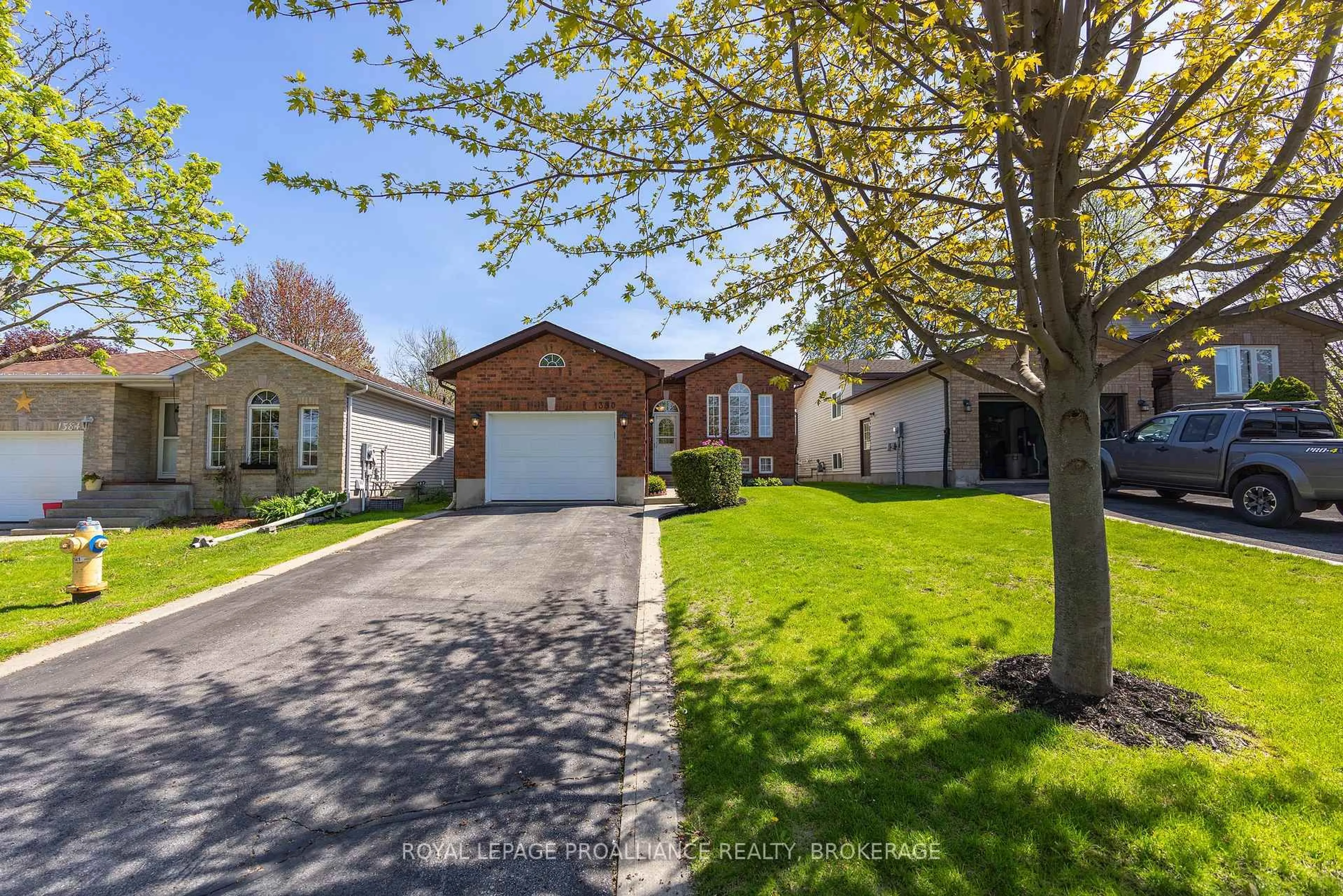 A pic from outside/outdoor area/front of a property/back of a property/a pic from drone, street for 1380 Fisher Cres, Kingston Ontario K7M 8T2