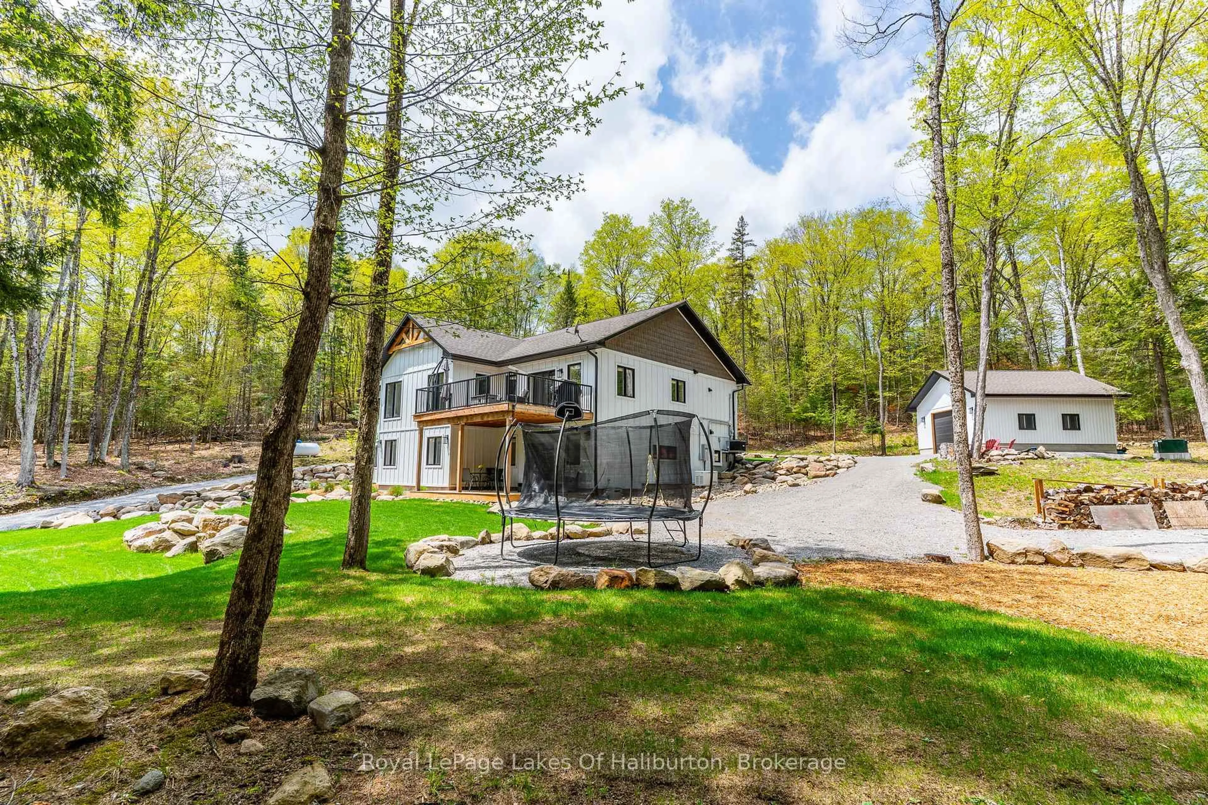 A pic from outside/outdoor area/front of a property/back of a property/a pic from drone, water/lake/river/ocean view for 51 Glebe Rd, Dysart et al Ontario K0M 1S0
