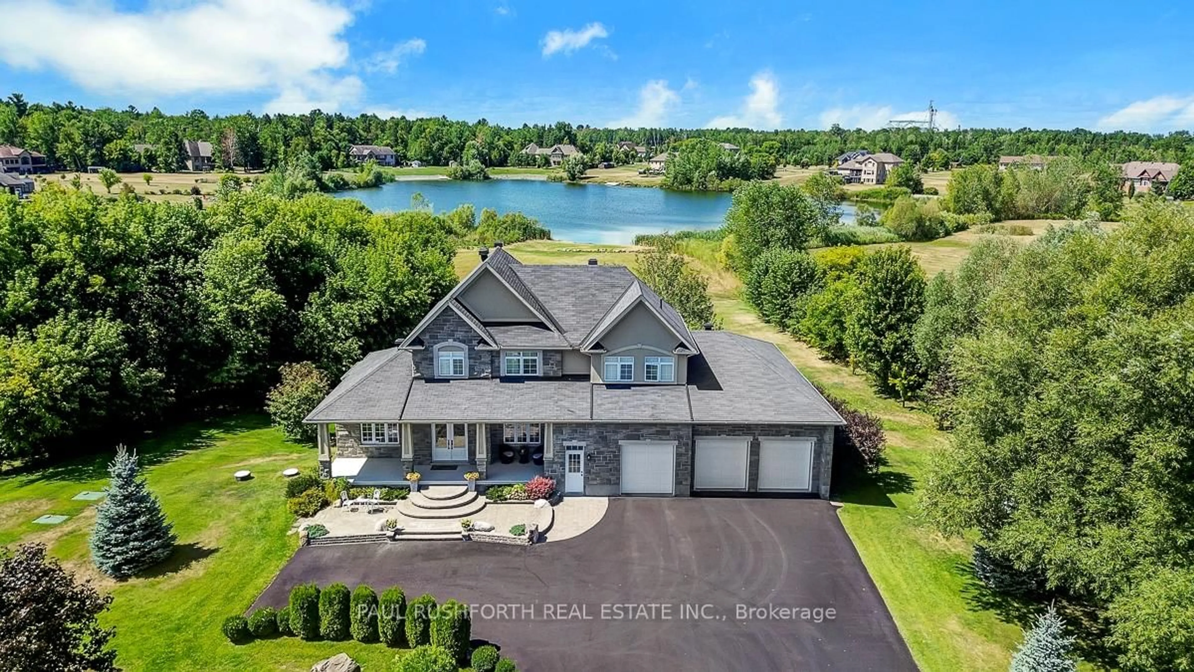 A pic from outside/outdoor area/front of a property/back of a property/a pic from drone, water/lake/river/ocean view for 365 West Lake Circ, Carp Ontario K0A 1L0