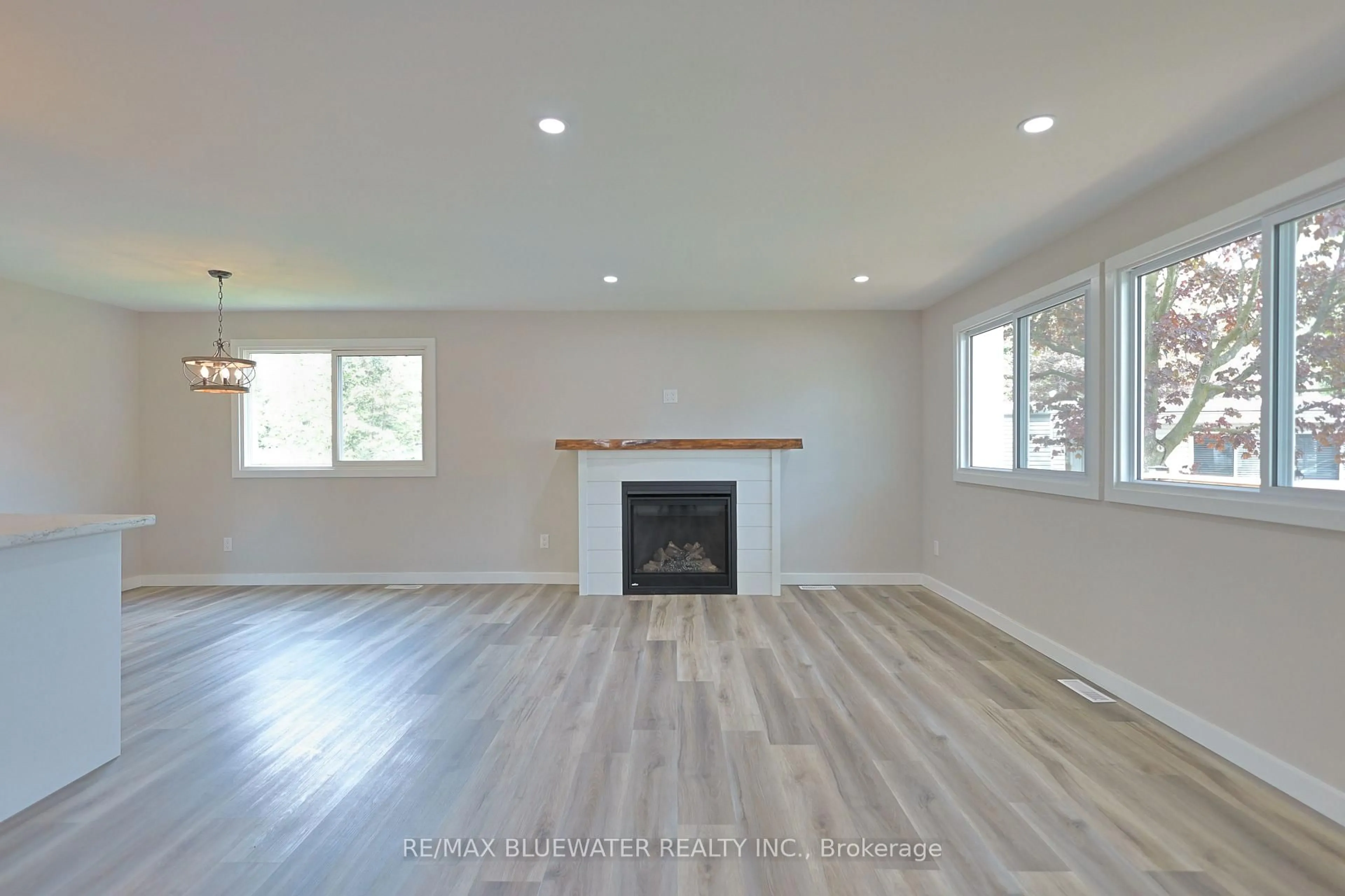 Living room with furniture, wood/laminate floor for 179 Pebble Beach Pkwy, South Huron Ontario N0M 1T0