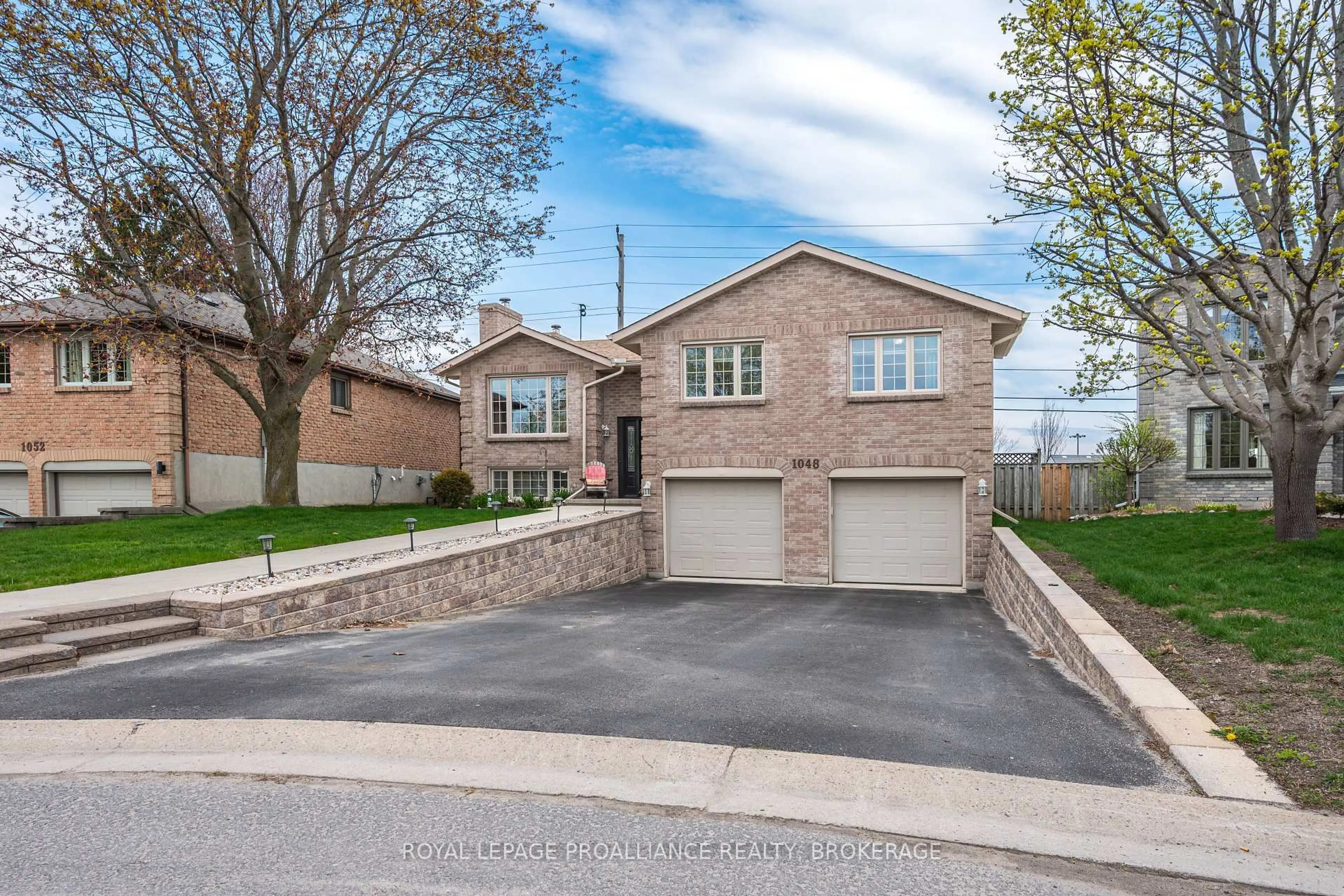 Home with brick exterior material, street for 1048 Palmerston Cres, Kingston Ontario K7P 2P5