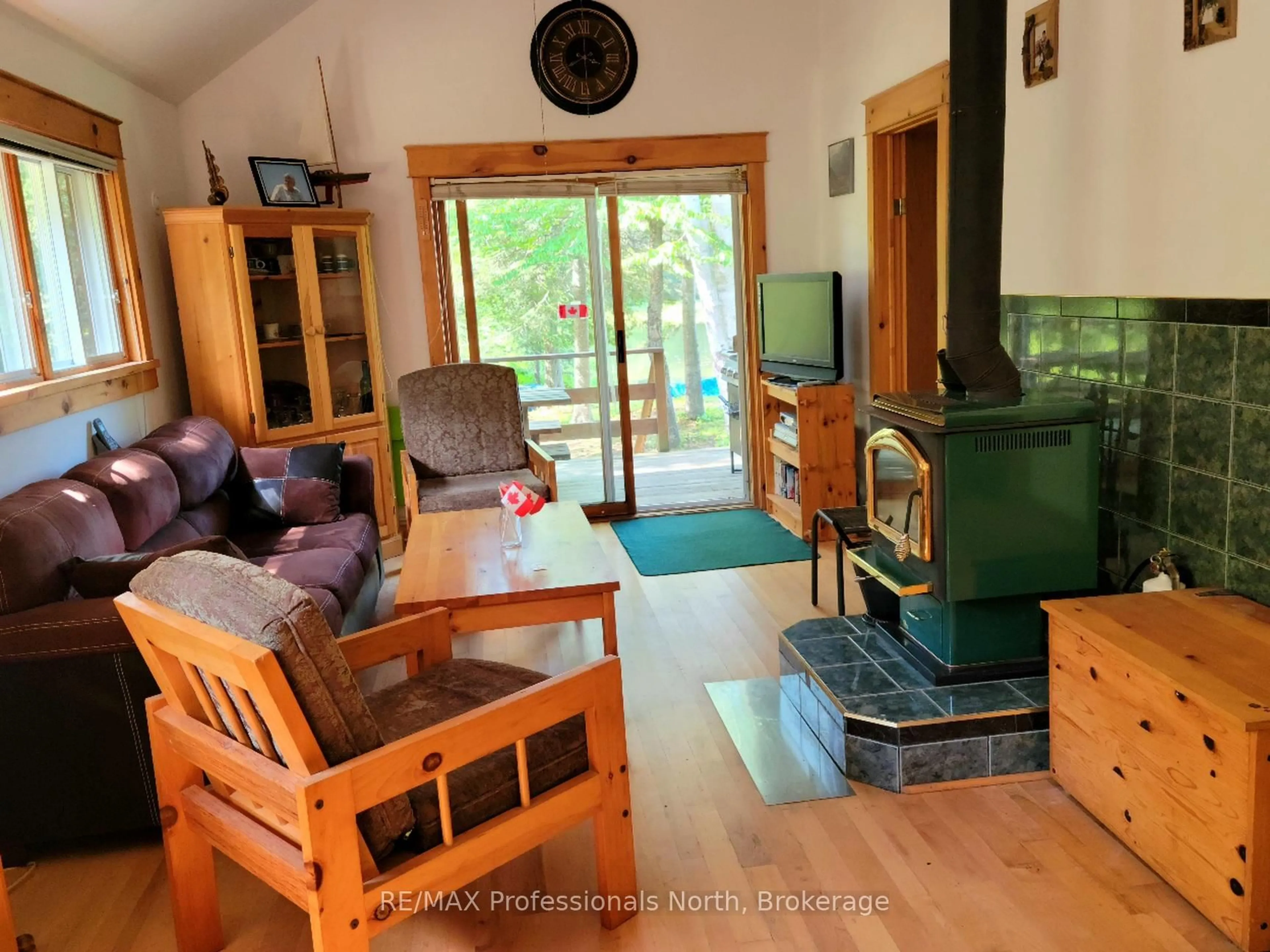 Living room with furniture, wood/laminate floor for 359 Grass Lake Rd, Kearney Ontario P0A 1M0