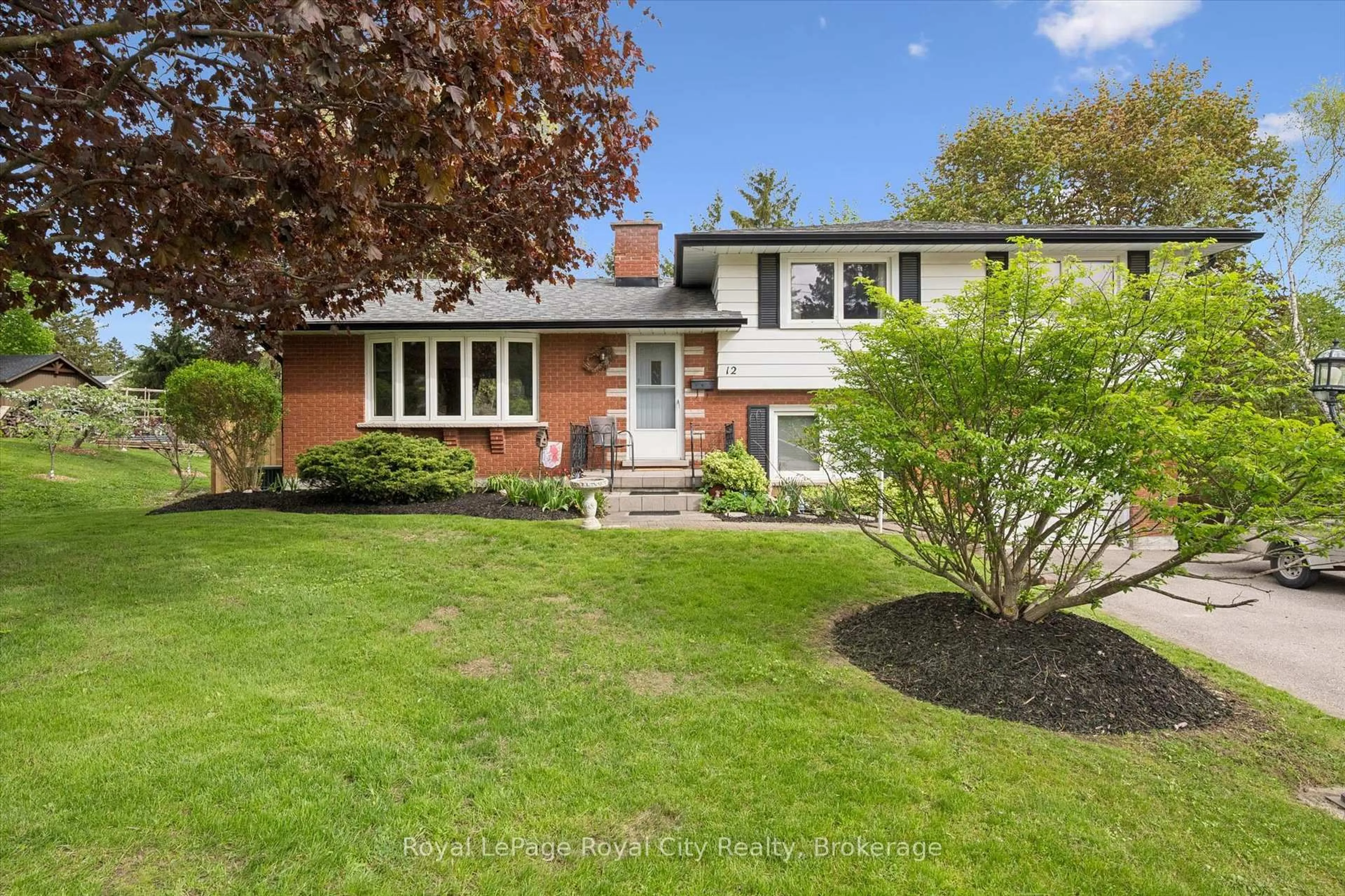 Home with brick exterior material, street for 12 Hamilton Dr, Guelph/Eramosa Ontario N1E 0N9