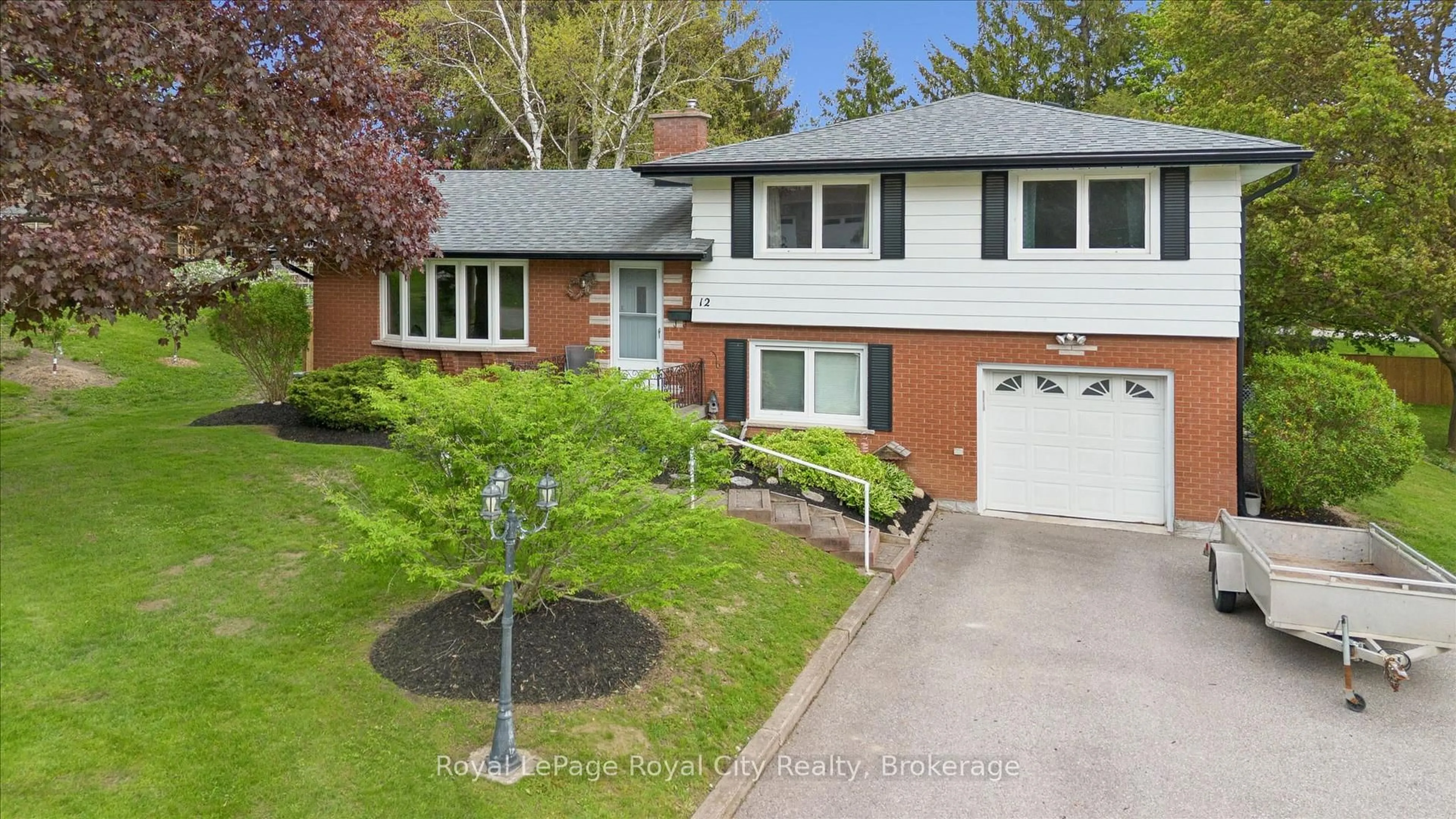 Home with brick exterior material, street for 12 Hamilton Dr, Guelph/Eramosa Ontario N1E 0N9