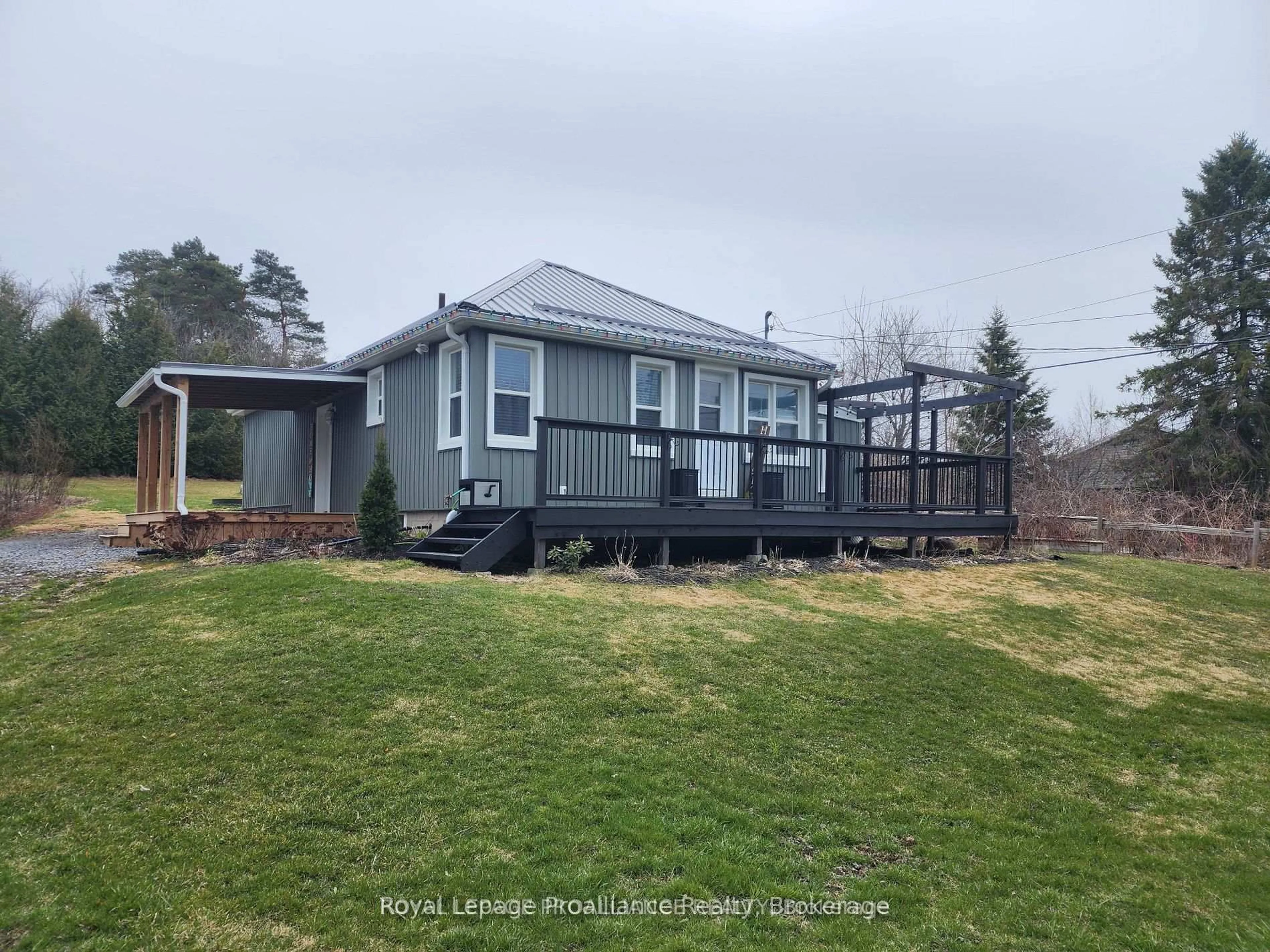 A pic from outside/outdoor area/front of a property/back of a property/a pic from drone, water/lake/river/ocean view for 2307 County Rd 3, Prince Edward County Ontario K0K 1L0