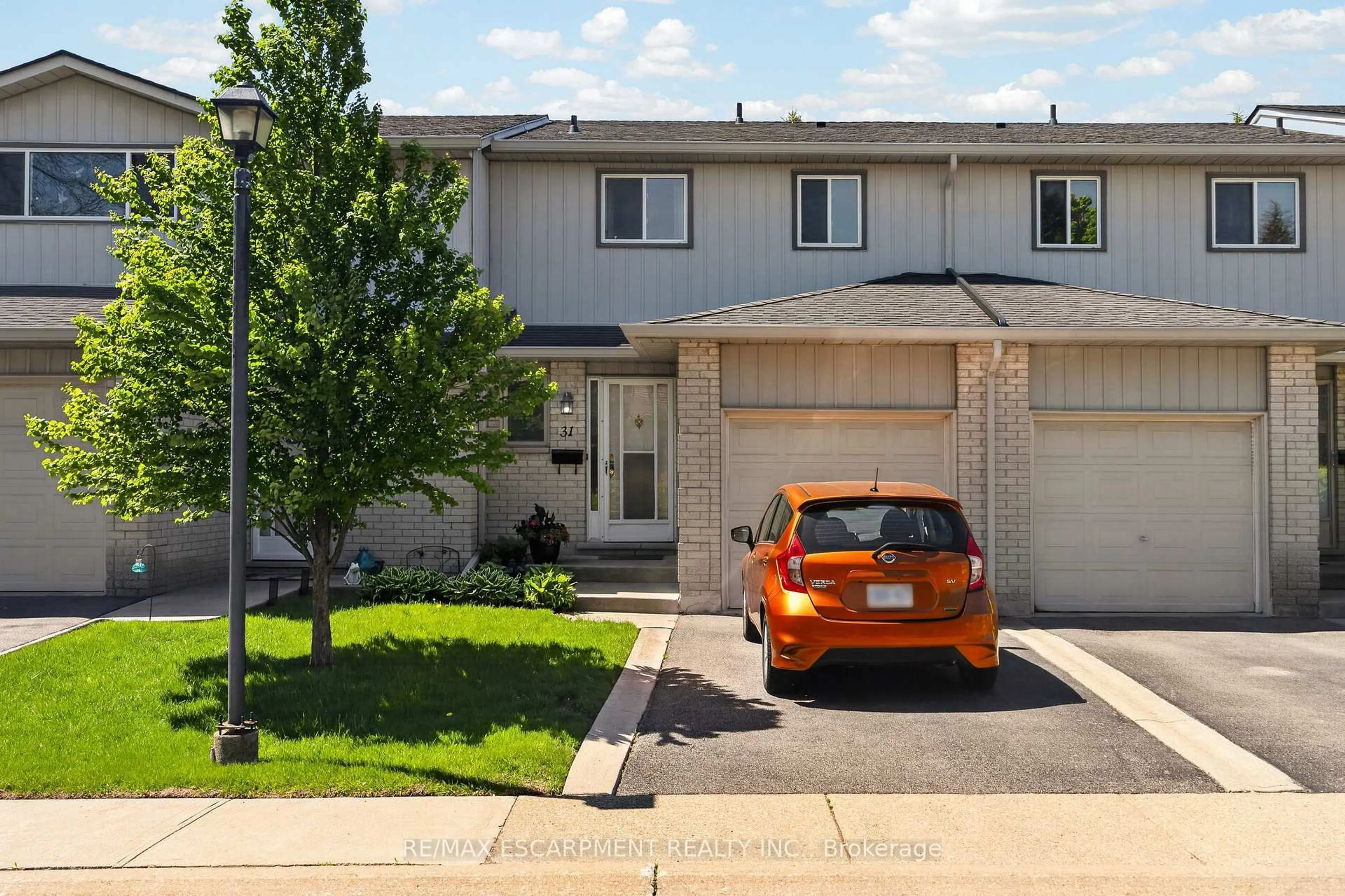 Home with vinyl exterior material, street for 1675 Upper Gage Ave #31, Hamilton Ontario L8W 3R8
