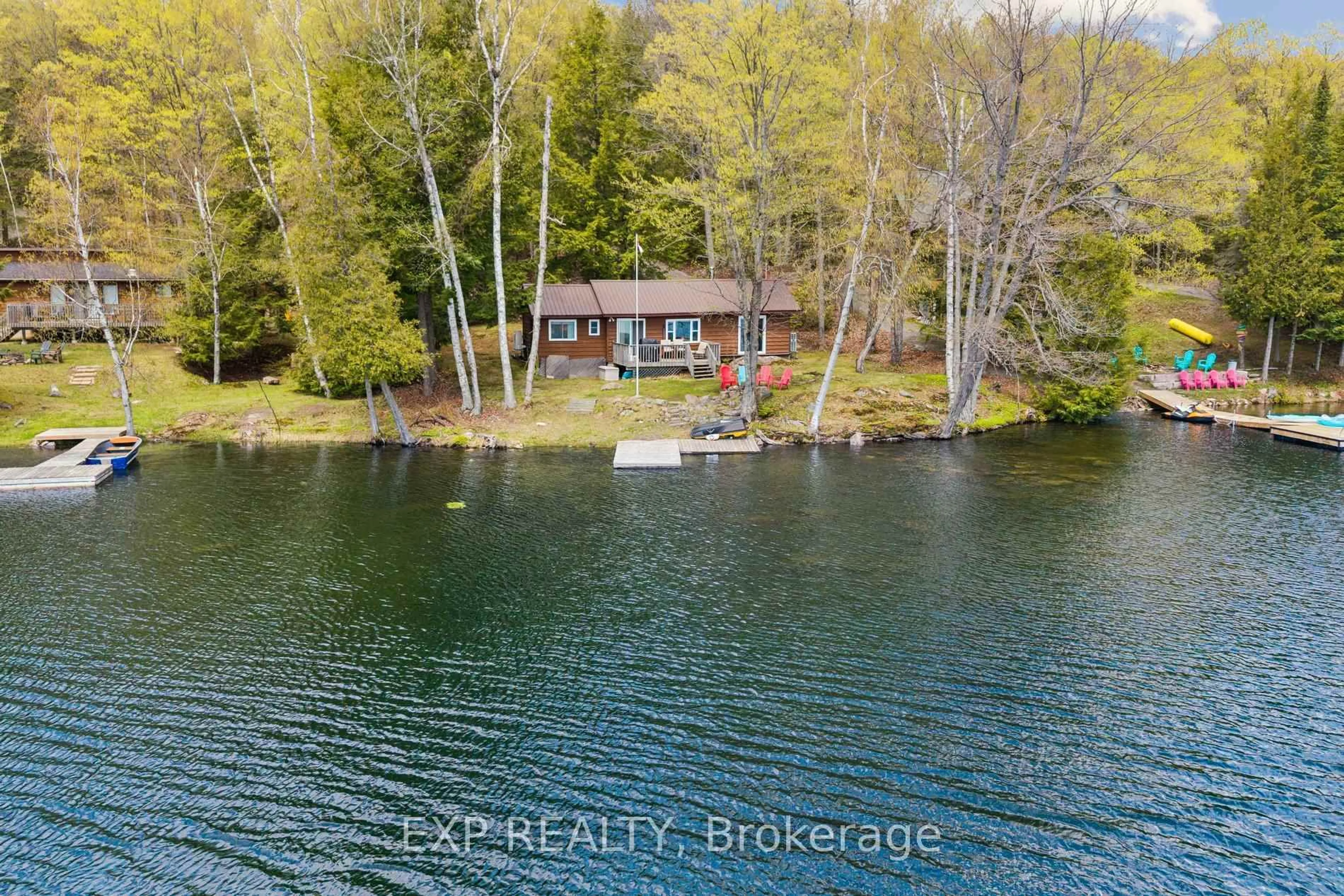 A pic from outside/outdoor area/front of a property/back of a property/a pic from drone, water/lake/river/ocean view for 1216 Lake Lorraine (Tory Lake) Lane, Highlands East Ontario K0L 2Y0