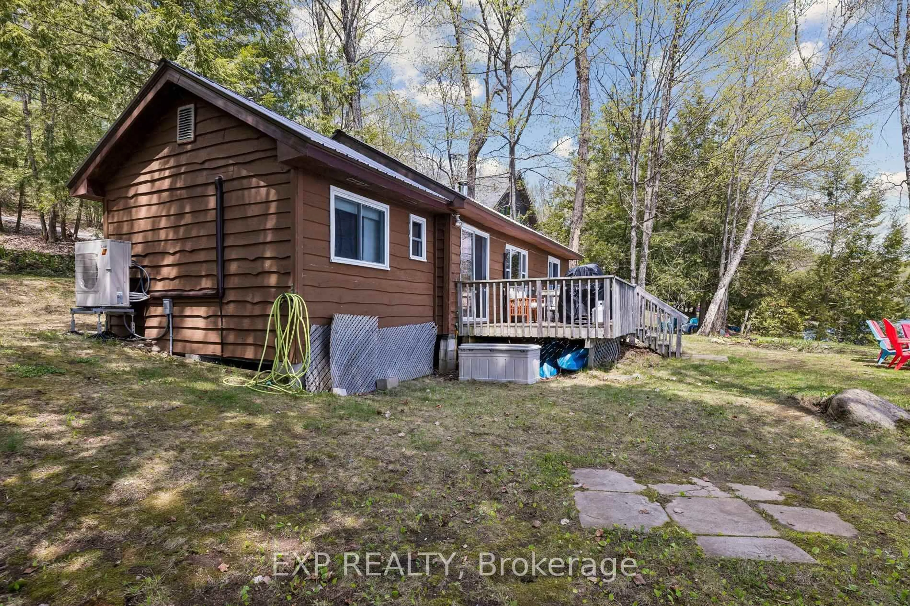 A pic from outside/outdoor area/front of a property/back of a property/a pic from drone, water/lake/river/ocean view for 1216 Lake Lorraine (Tory Lake) Lane, Highlands East Ontario K0L 2Y0