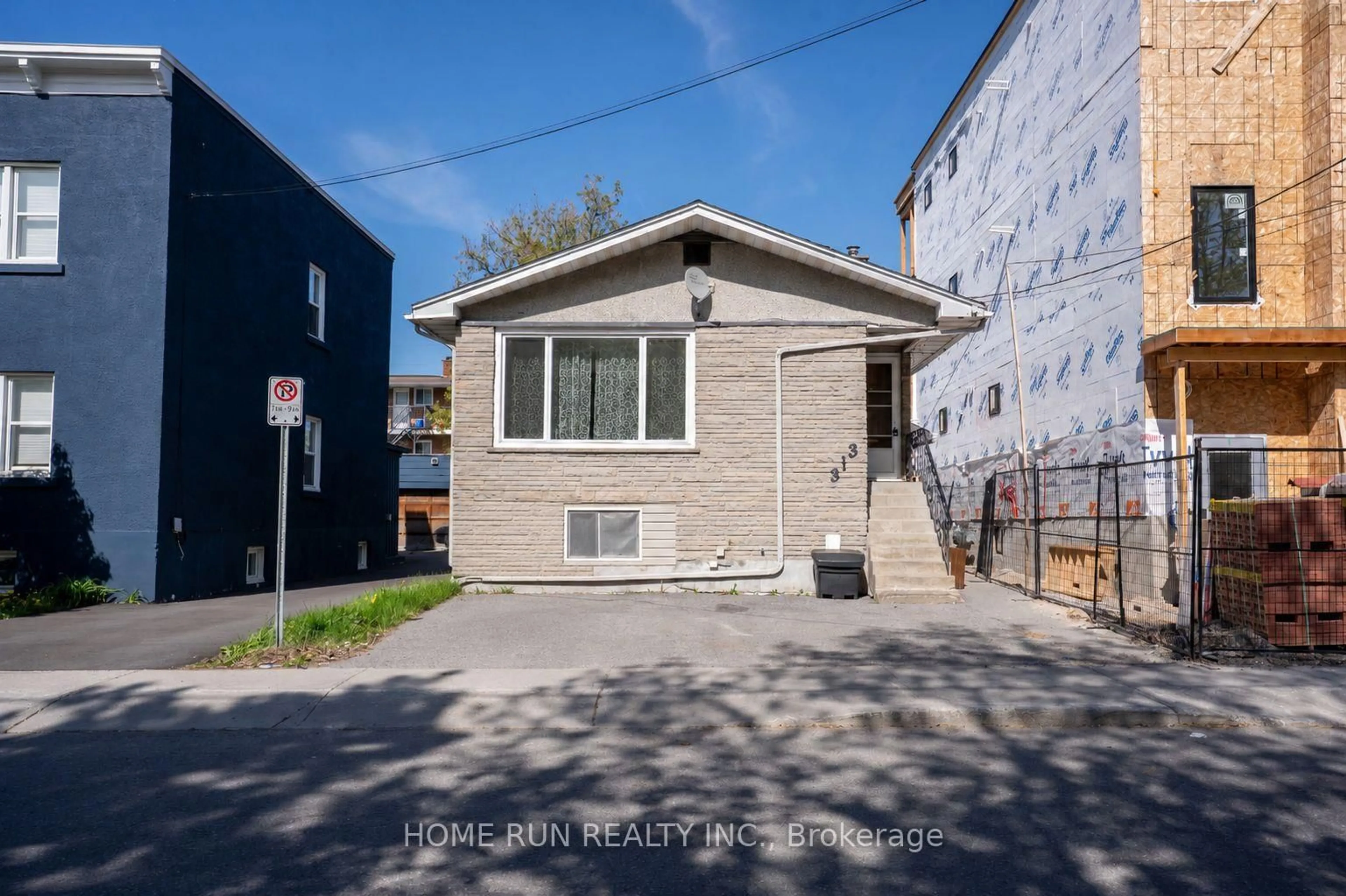 Home with vinyl exterior material, street for 313 Savard Ave, Ottawa Ontario K1L 7S1