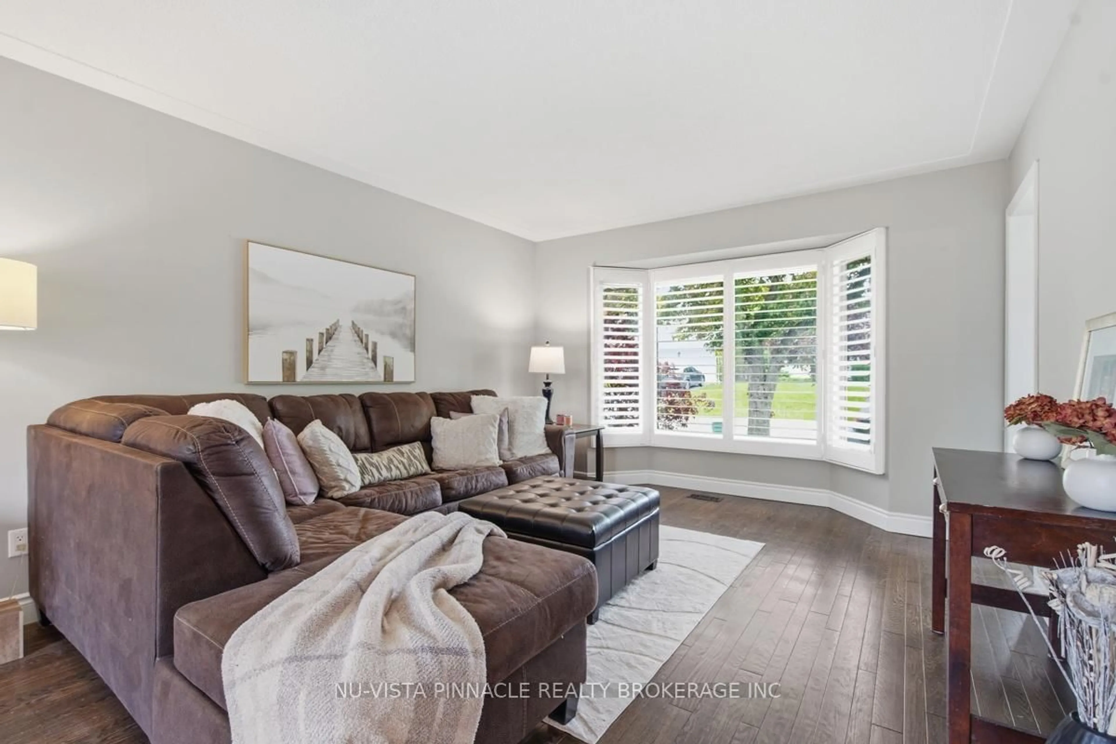 Living room with furniture, wood/laminate floor for 11 Runnymede Cres, London North Ontario N6G 1Z7