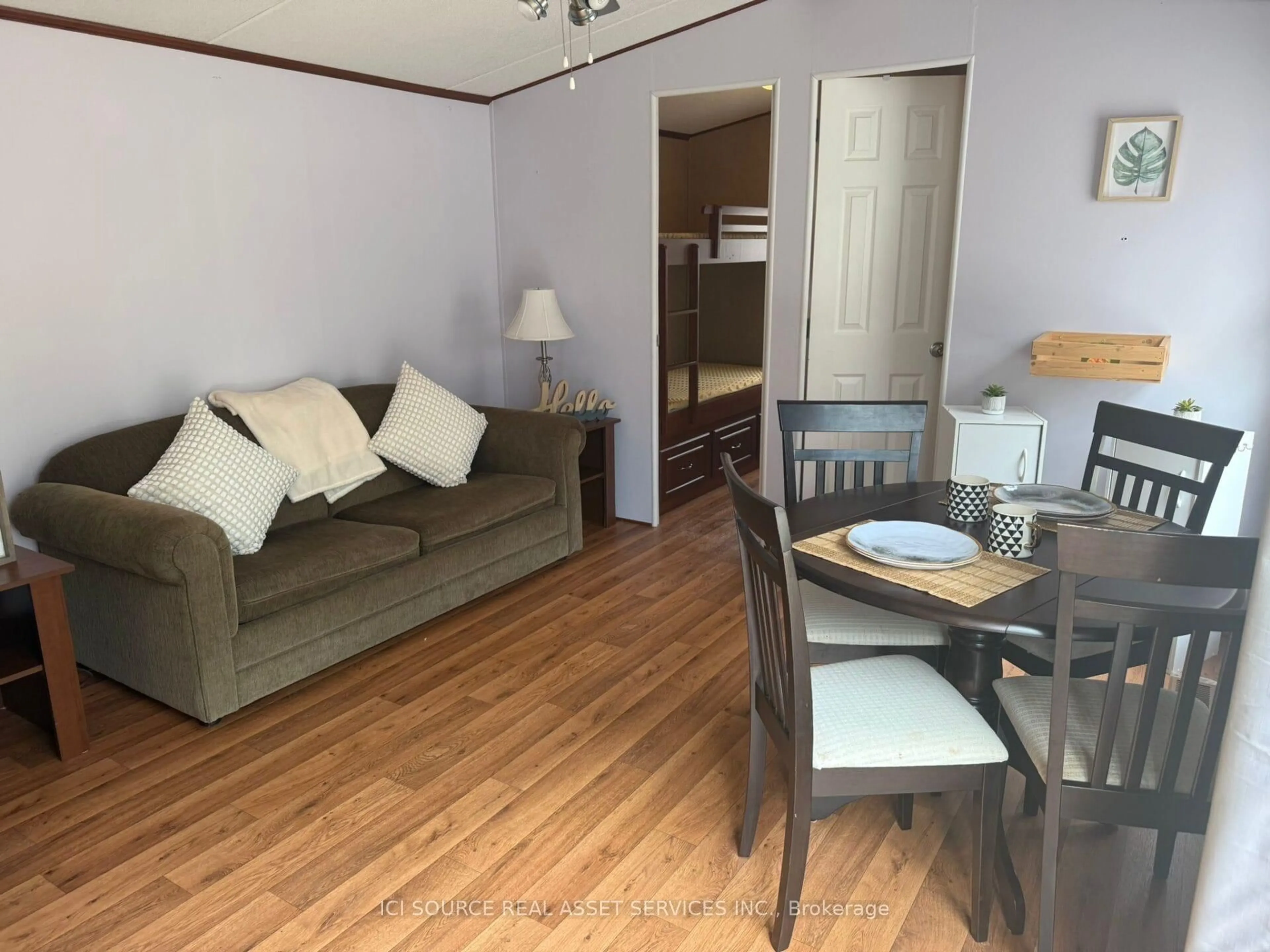 Living room with furniture, wood/laminate floor for 1336 S Morrison Lake Rd #MOR09, Gravenhurst Ontario P0E 1G0