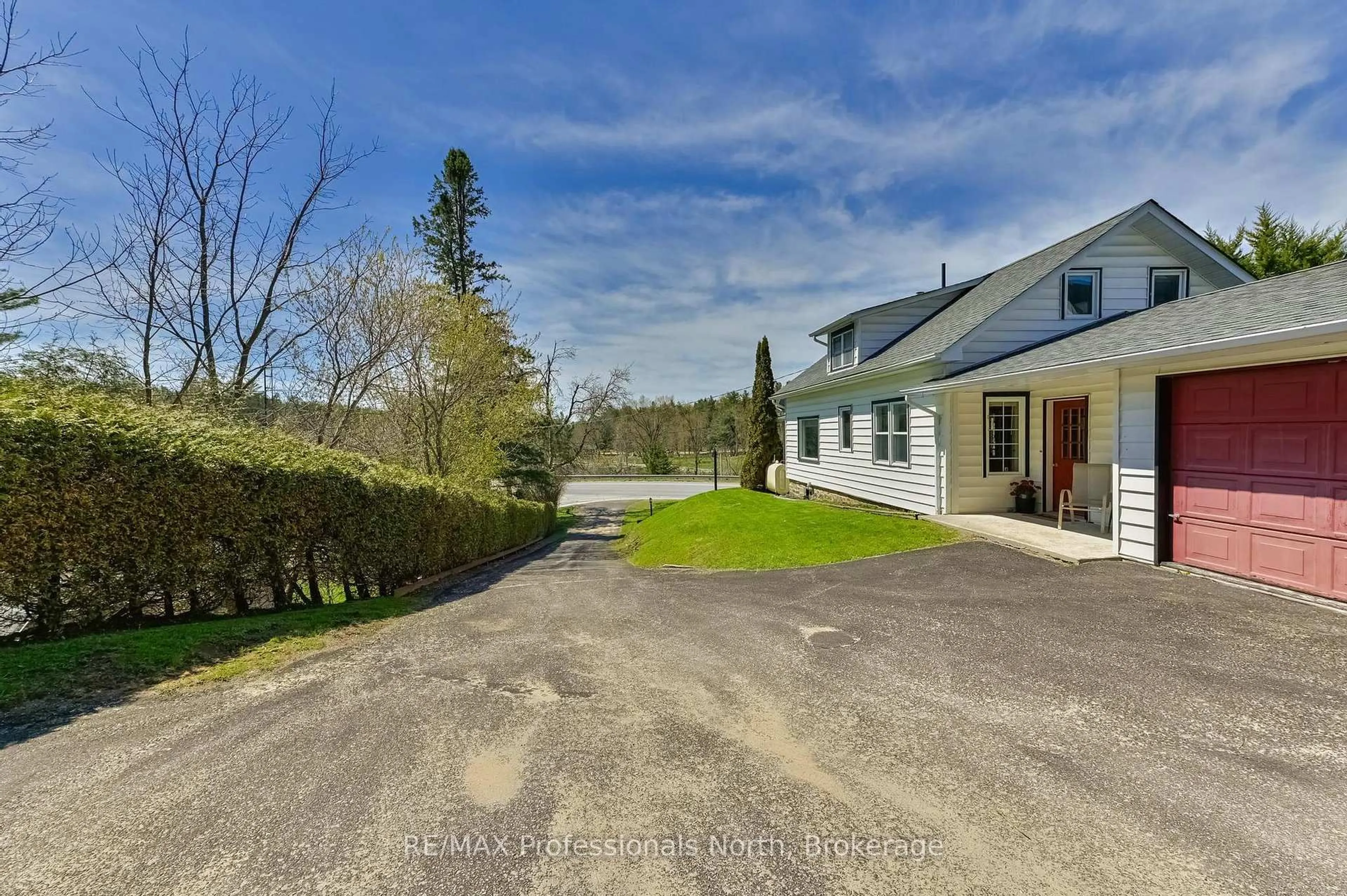 A pic from outside/outdoor area/front of a property/back of a property/a pic from drone, street for 4050 County Road 121, Kawartha Lakes Ontario K0M 2A0