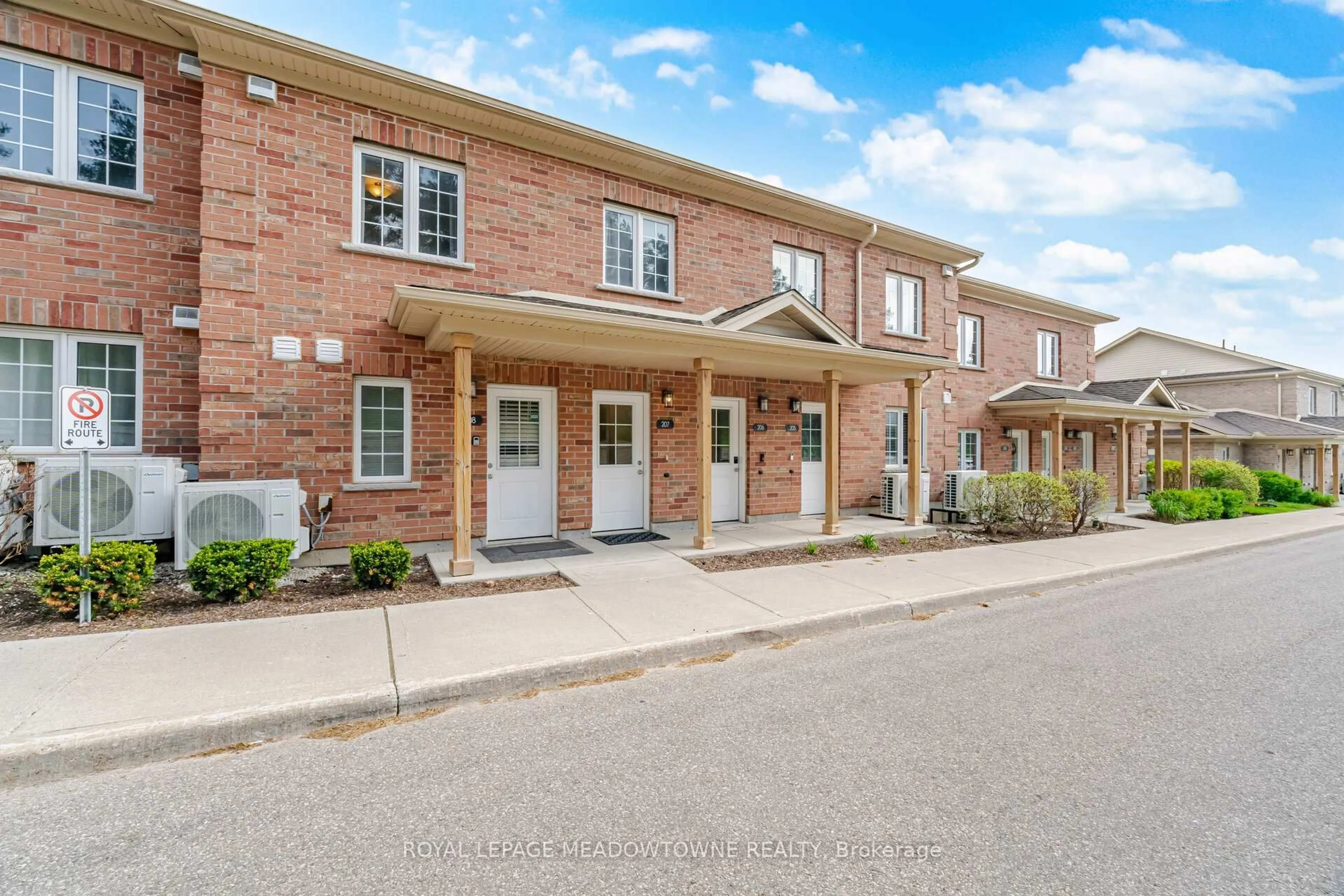 Home with brick exterior material, street for 7 Cityview Dr #207, Guelph Ontario N1E 0R1