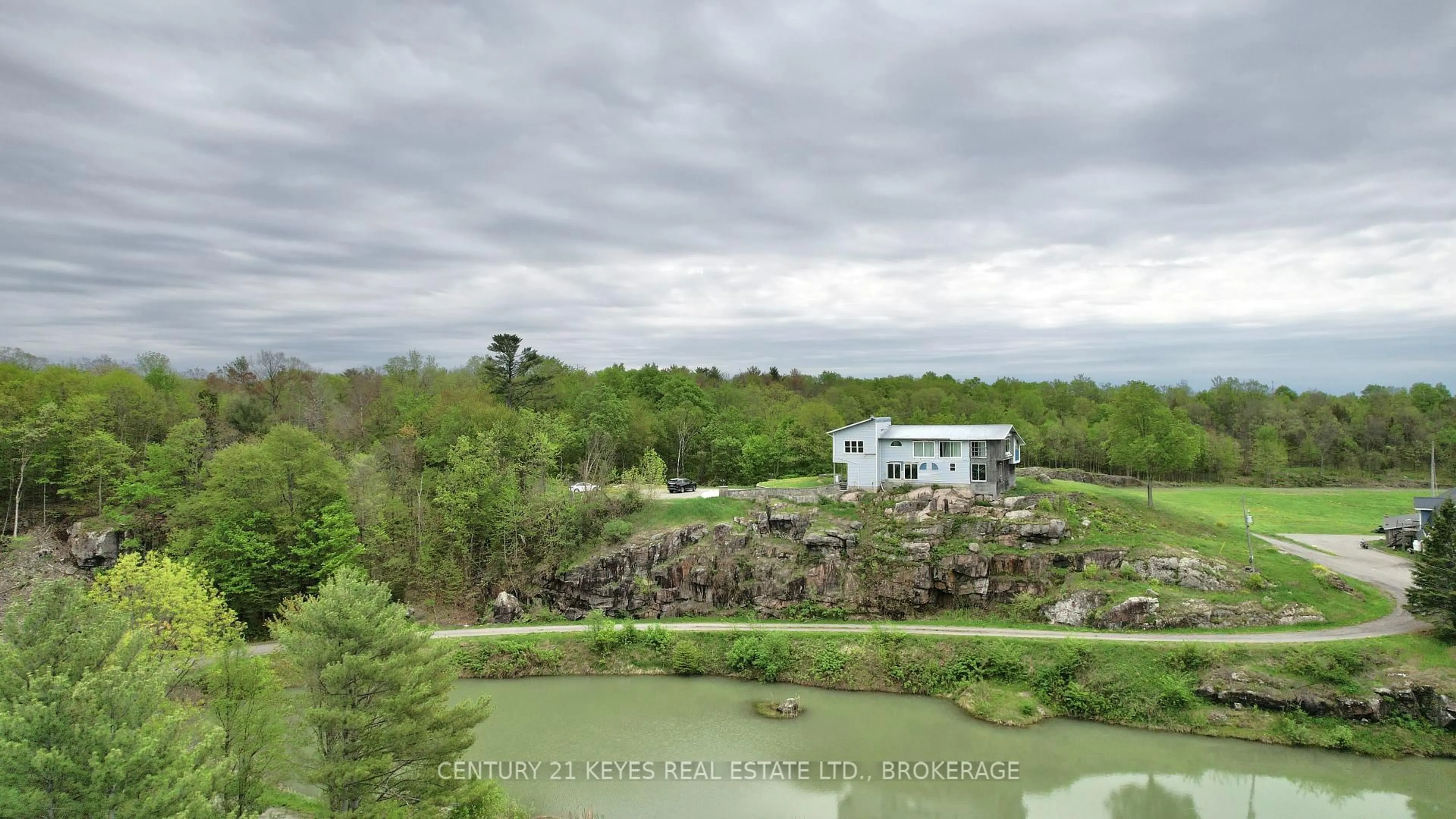 A pic from outside/outdoor area/front of a property/back of a property/a pic from drone, water/lake/river/ocean view for 151 County Rd 5 Rd, Front of Yonge Ontario K0E 1R0