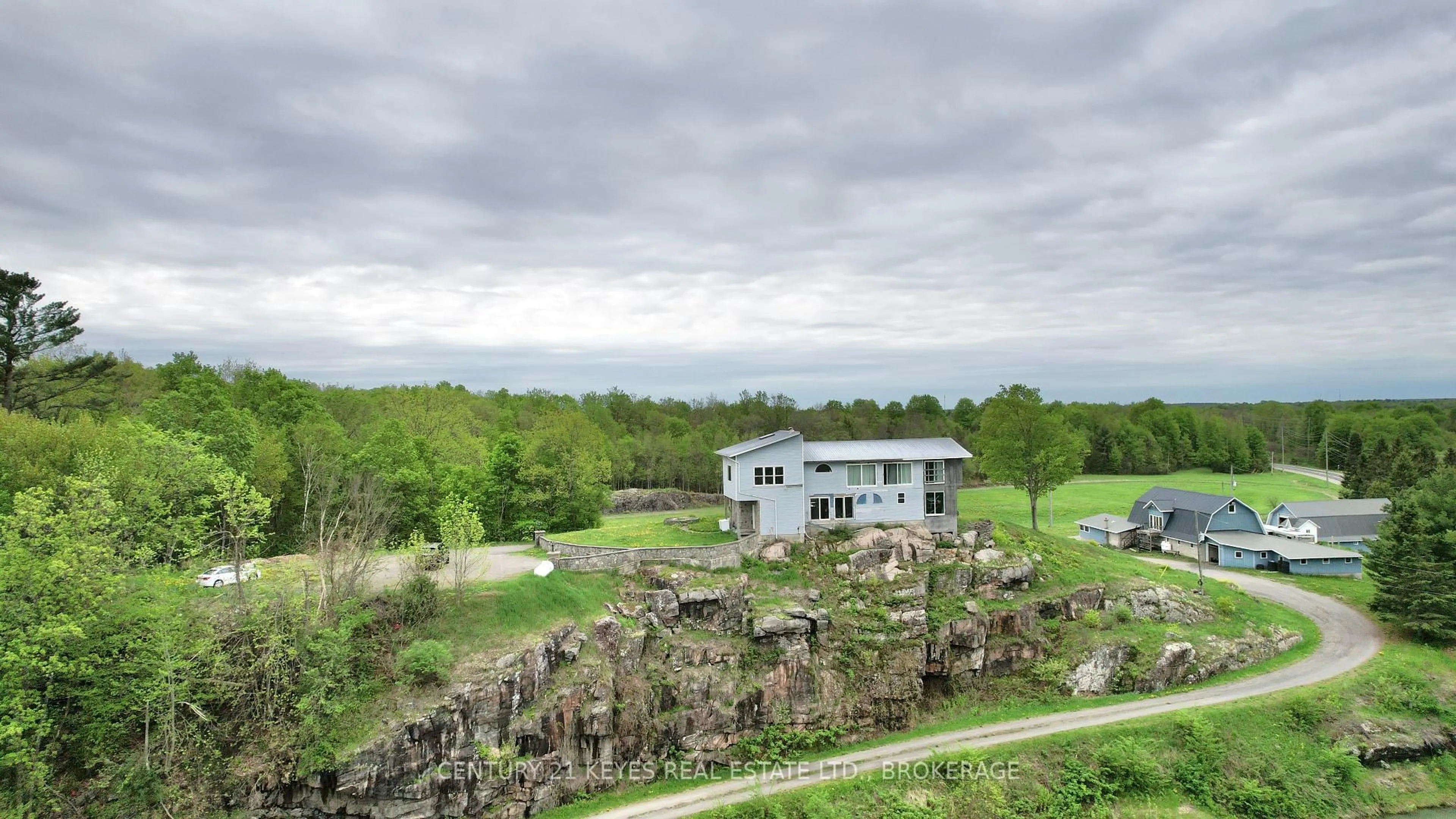 A pic from outside/outdoor area/front of a property/back of a property/a pic from drone, forest/trees view for 151 County Rd 5 Rd, Front of Yonge Ontario K0E 1R0