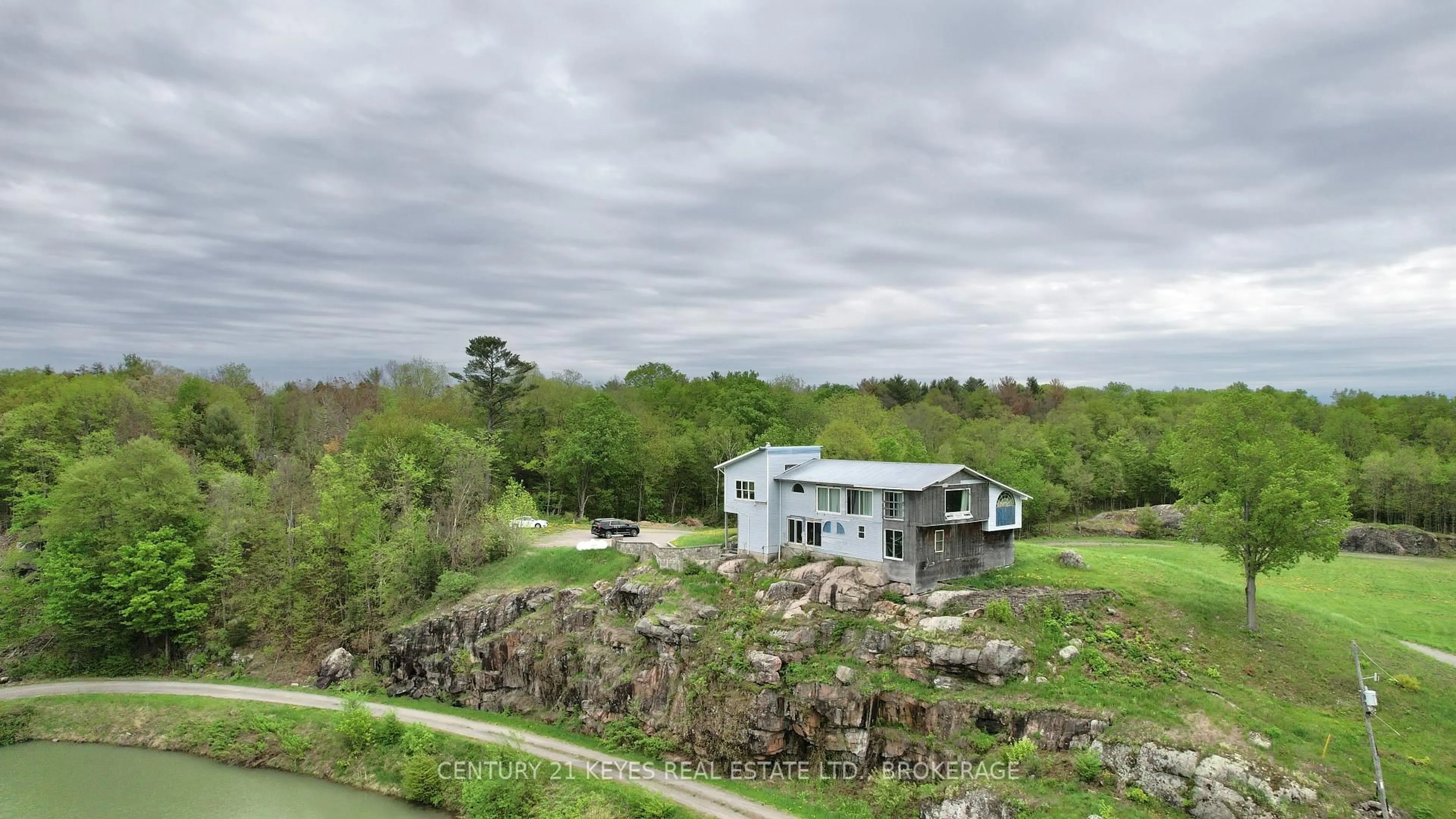 A pic from outside/outdoor area/front of a property/back of a property/a pic from drone, water/lake/river/ocean view for 151 County Rd 5 Rd, Front of Yonge Ontario K0E 1R0