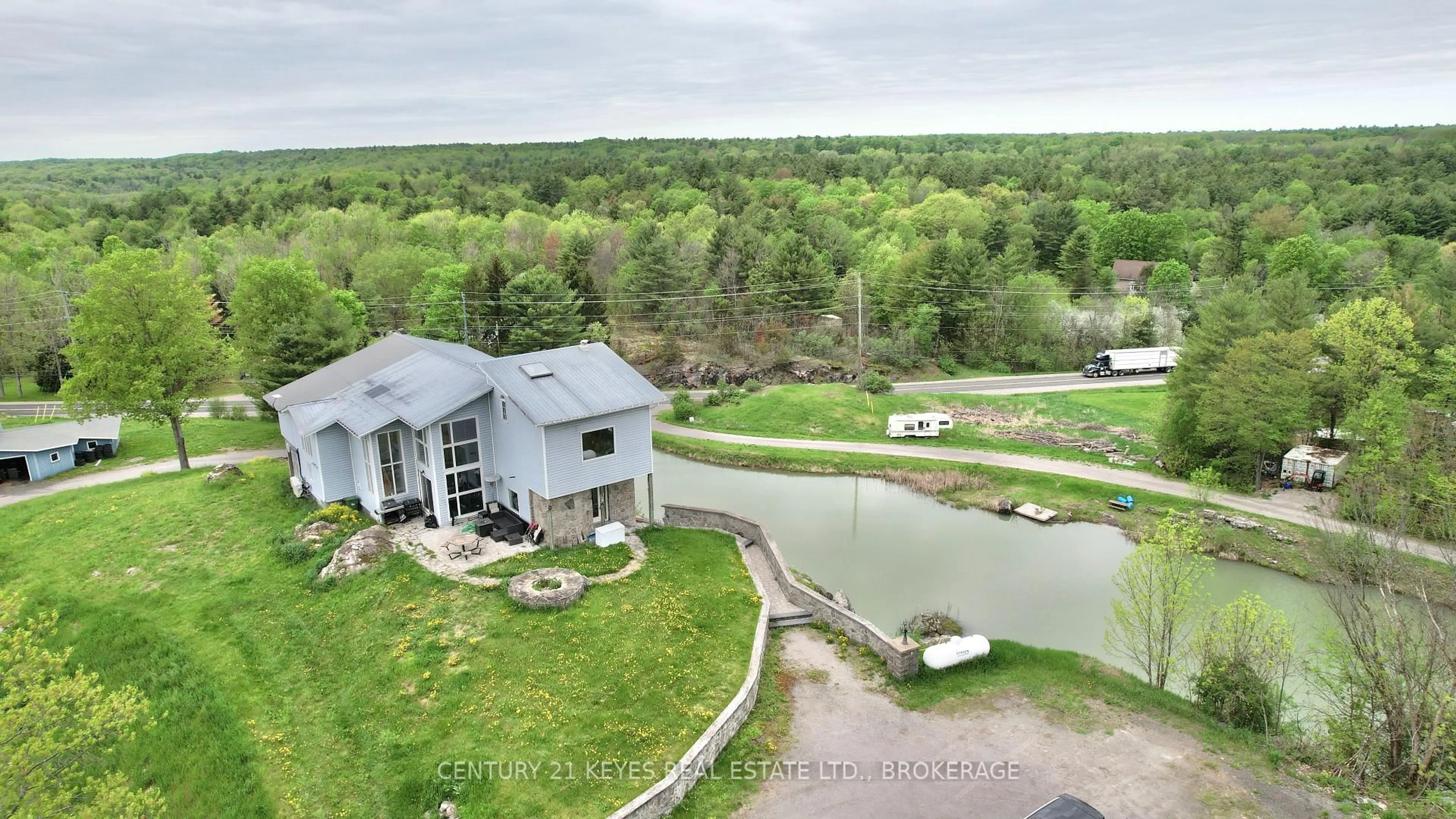 A pic from outside/outdoor area/front of a property/back of a property/a pic from drone, water/lake/river/ocean view for 151 County Rd 5 Rd, Front of Yonge Ontario K0E 1R0