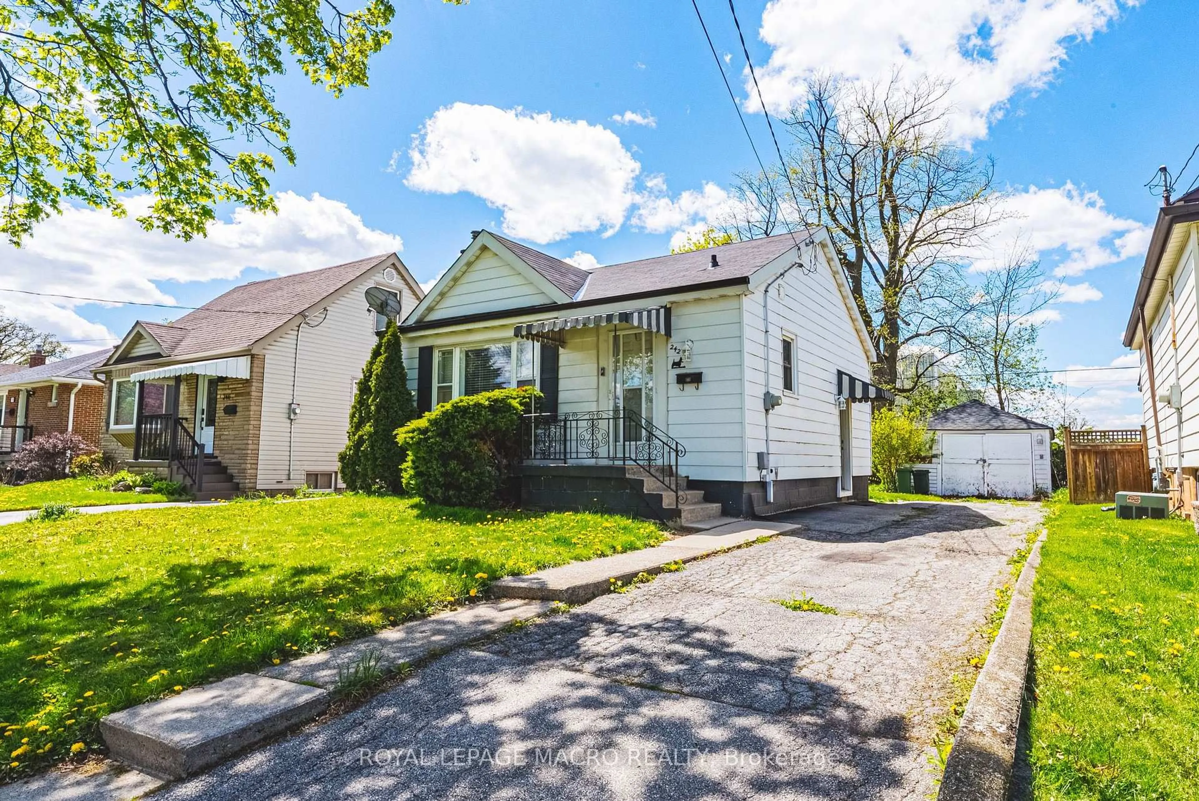 Home with vinyl exterior material, street for 242 East 43rd St, Hamilton Ontario L8T 3C5