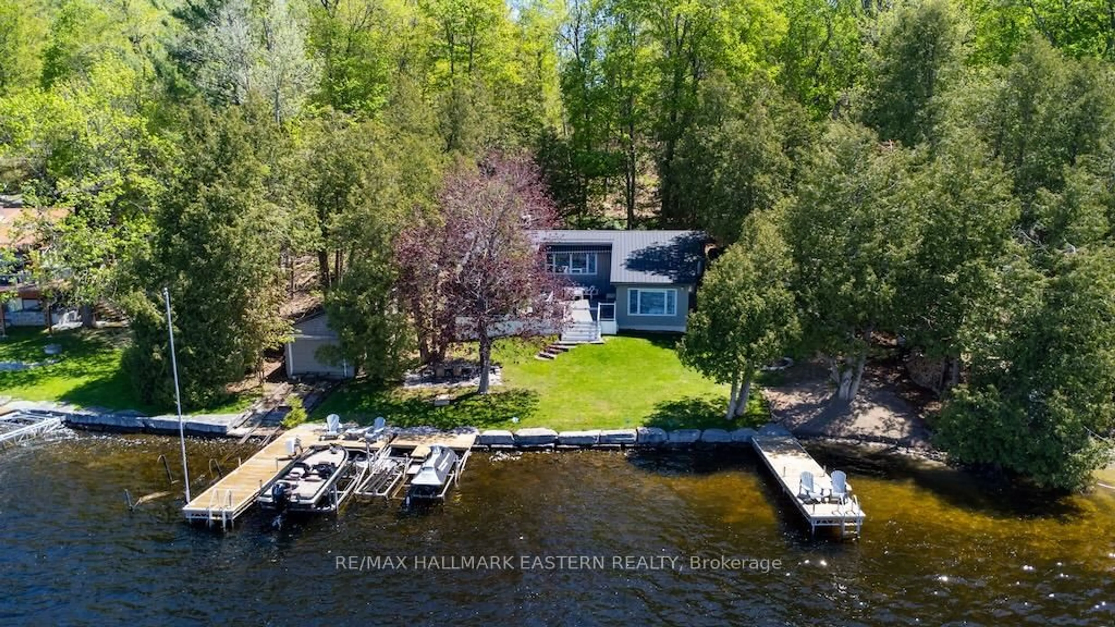 A pic from outside/outdoor area/front of a property/back of a property/a pic from drone, water/lake/river/ocean view for 33 Pineway Crt, Trent Lakes Ontario K0L 1J0