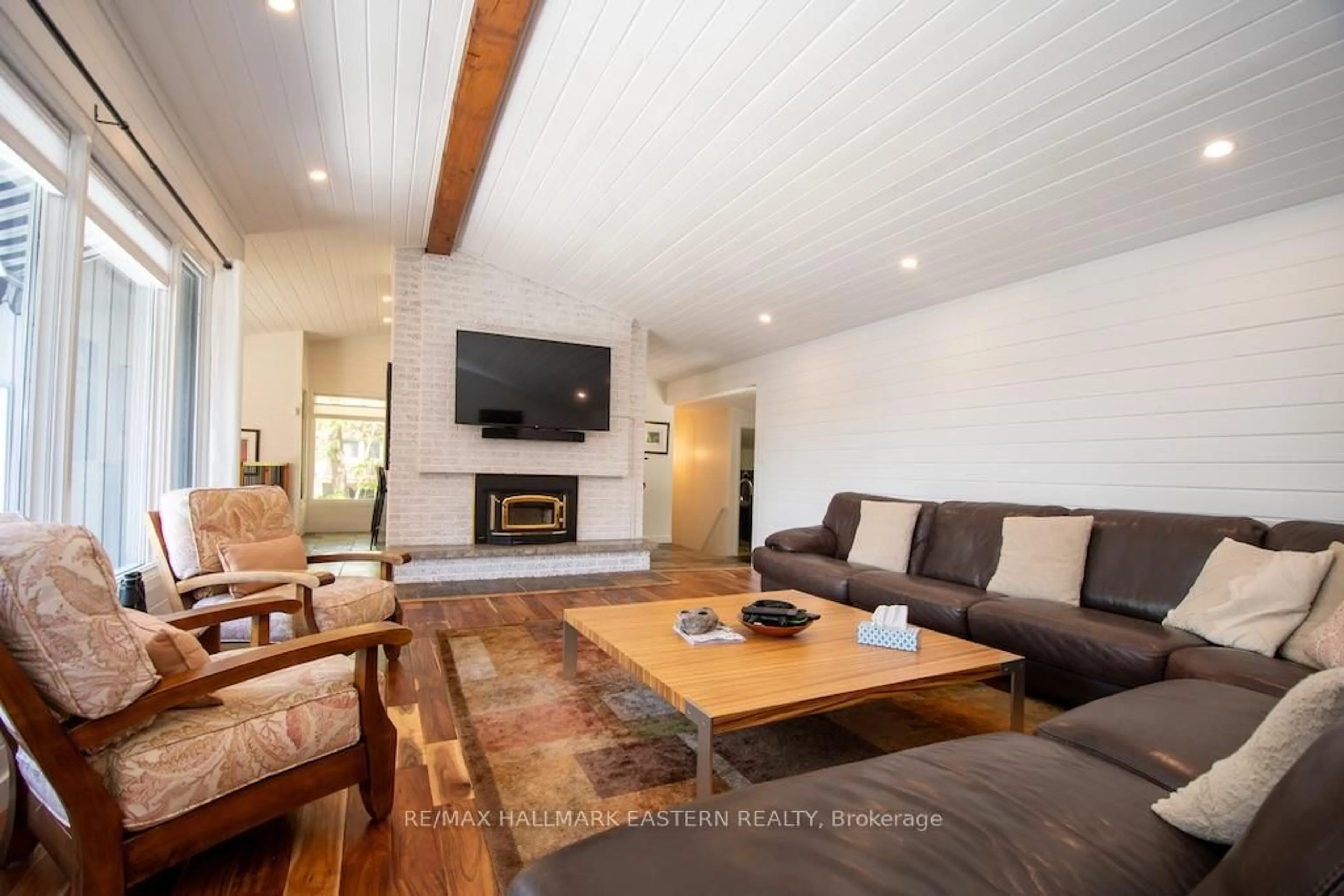 Living room with furniture, wood/laminate floor for 33 Pineway Crt, Trent Lakes Ontario K0L 1J0