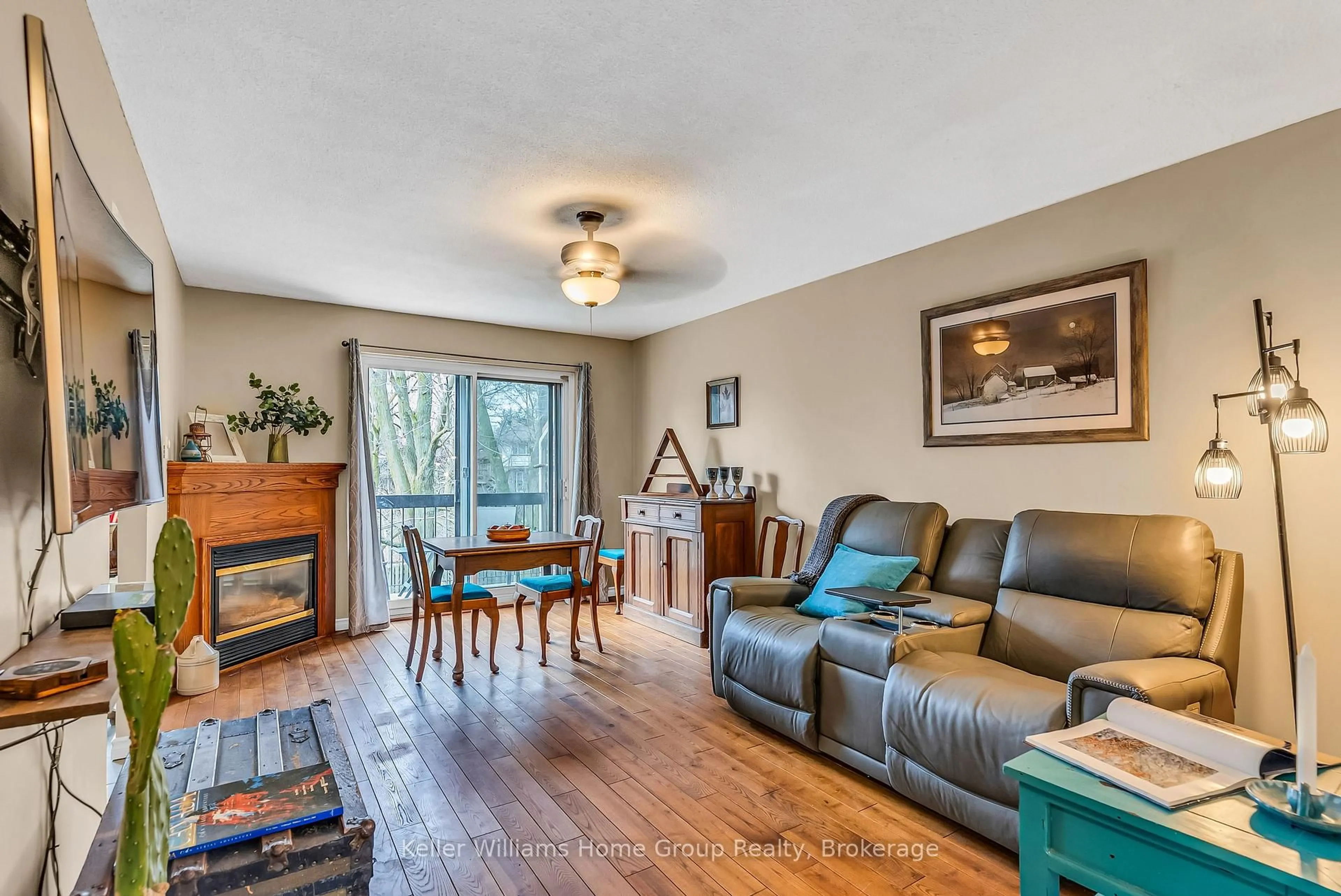 Living room with furniture, wood/laminate floor for 49 Rhonda Rd #119, Guelph Ontario N1H 7A4