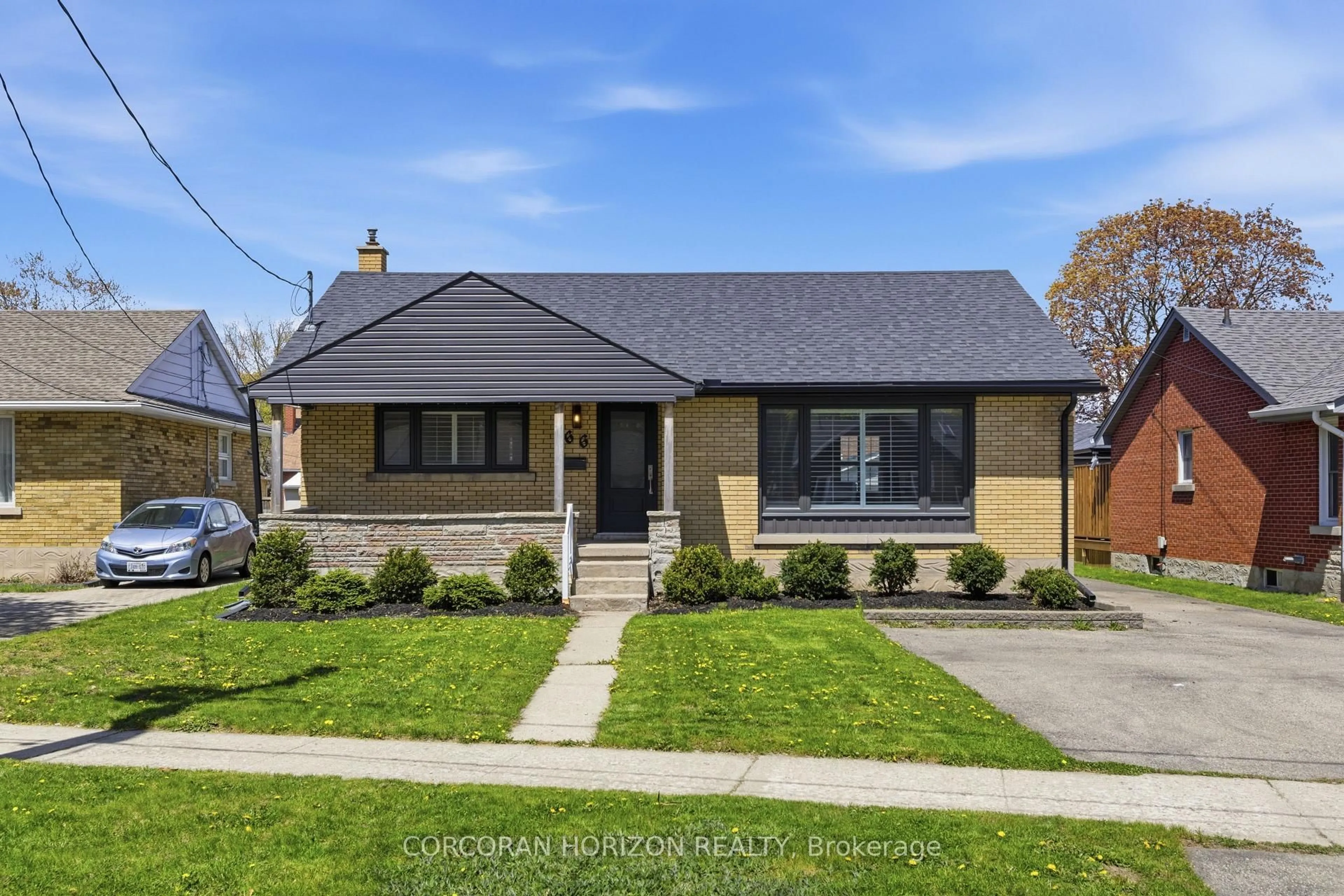 Home with brick exterior material, street for 66 Heather Ave, Kitchener Ontario N2B 1M1