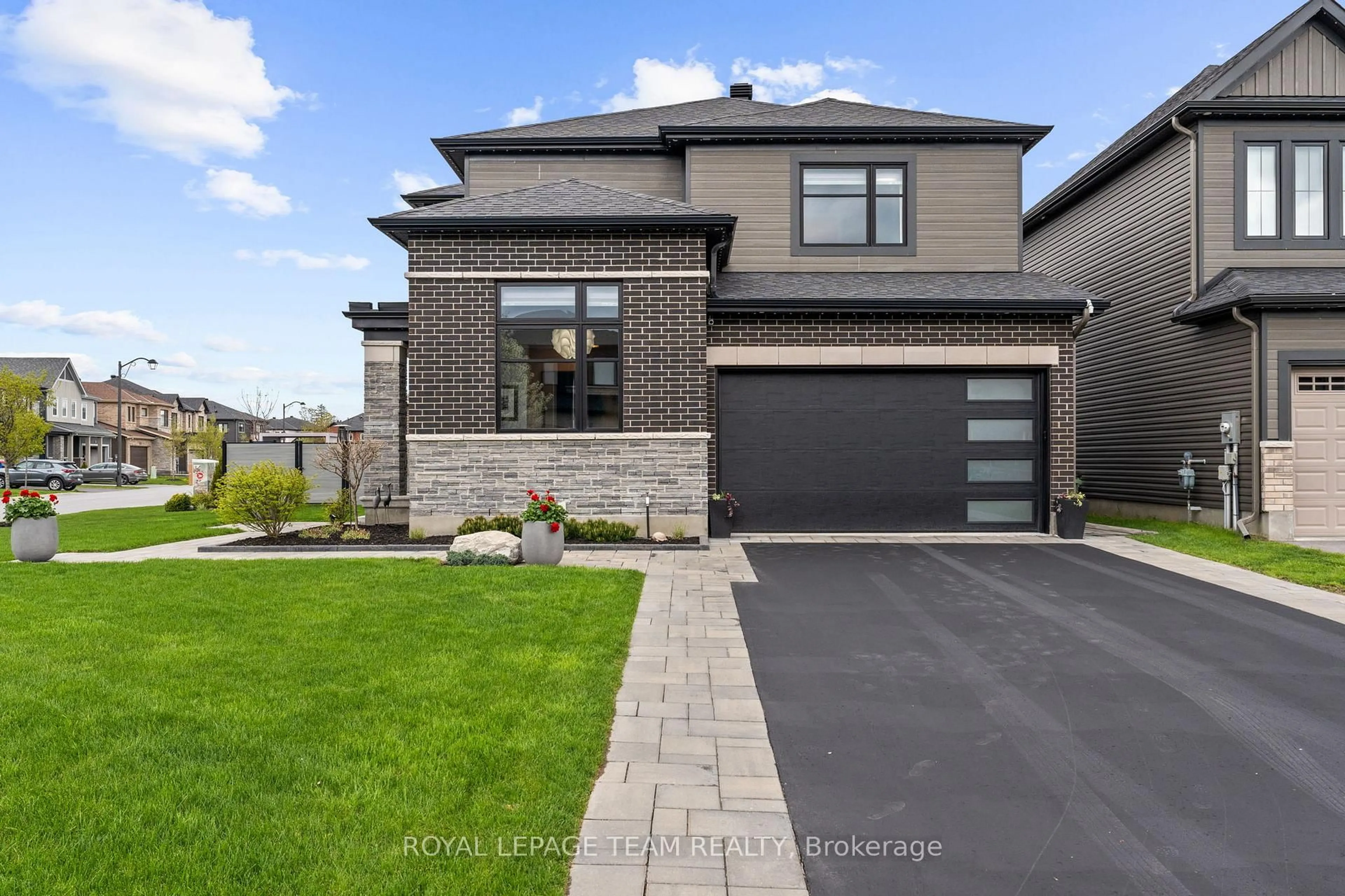 Home with brick exterior material, street for 63 Yacht Terr, Manotick Ontario K4M 0N3