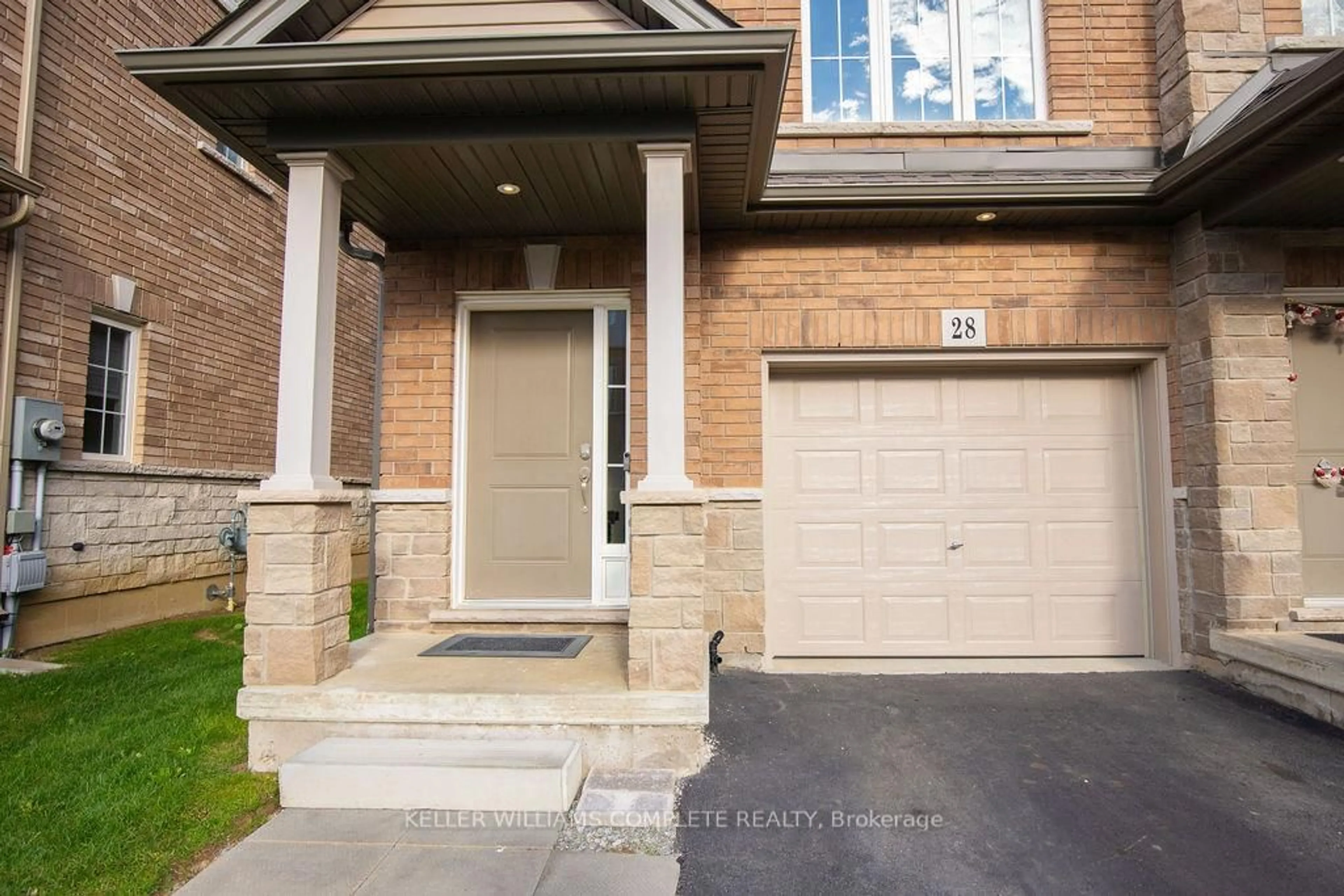 Home with brick exterior material, street for 28 CANARY GRASS Blvd, Hamilton Ontario L0R 1P0