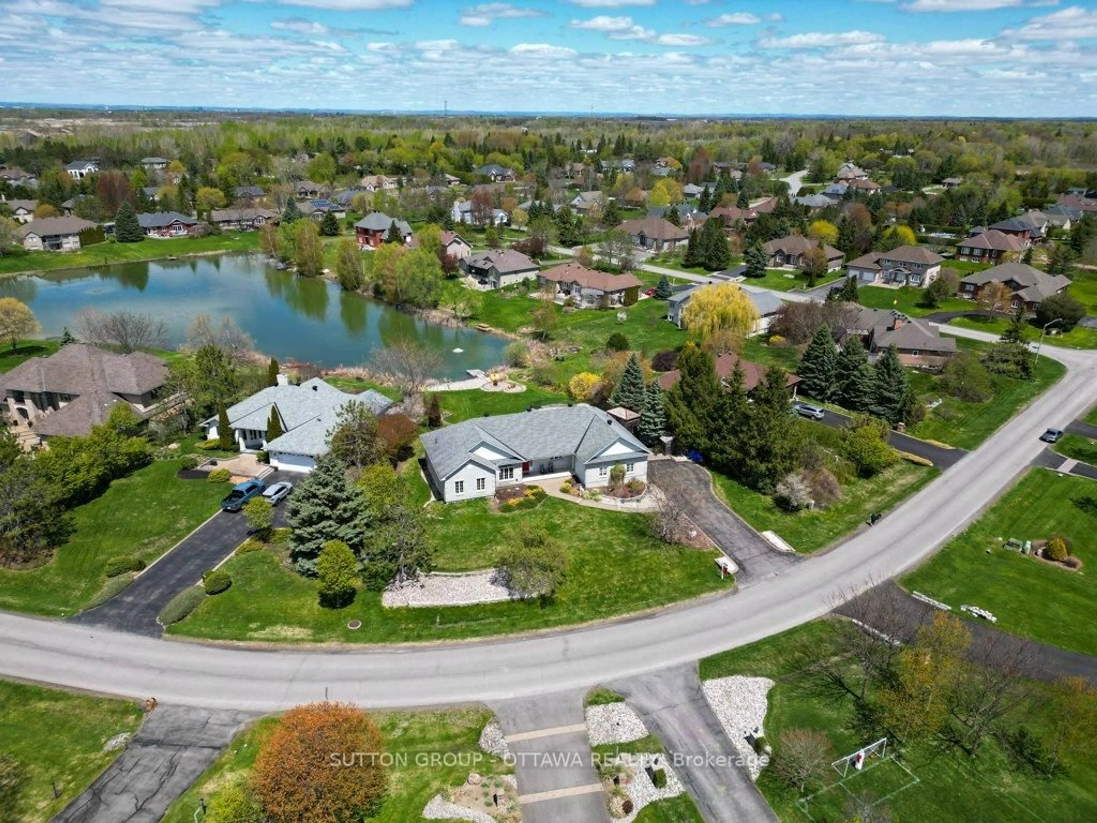 A pic from outside/outdoor area/front of a property/back of a property/a pic from drone, water/lake/river/ocean view for 6881 Lakes Park Dr, Greely Ontario K4P 1P1