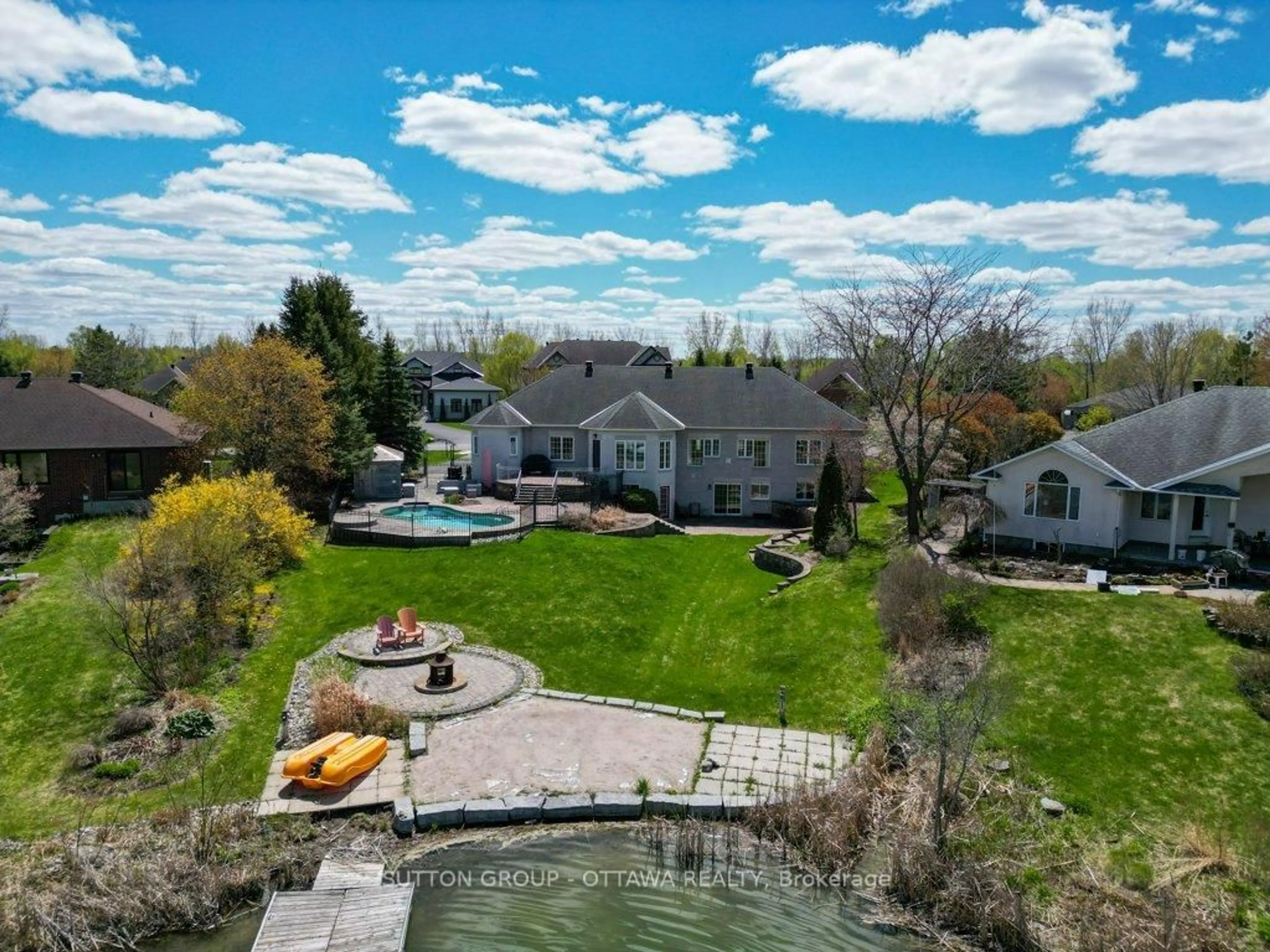 A pic from outside/outdoor area/front of a property/back of a property/a pic from drone, water/lake/river/ocean view for 6881 Lakes Park Dr, Greely Ontario K4P 1P1
