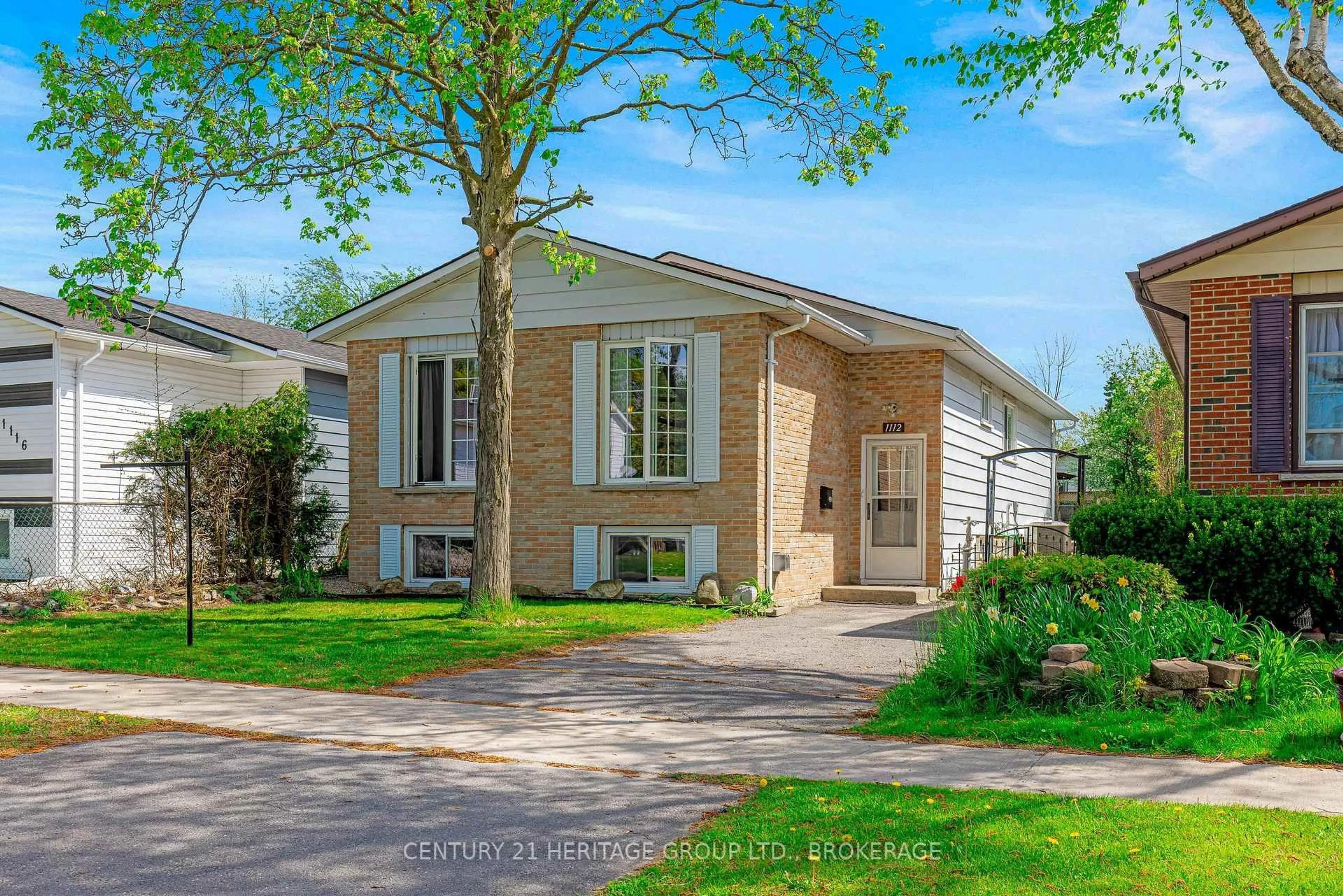 Home with brick exterior material, street for 1112 Basswood Pl, Kingston Ontario K7P 1K6