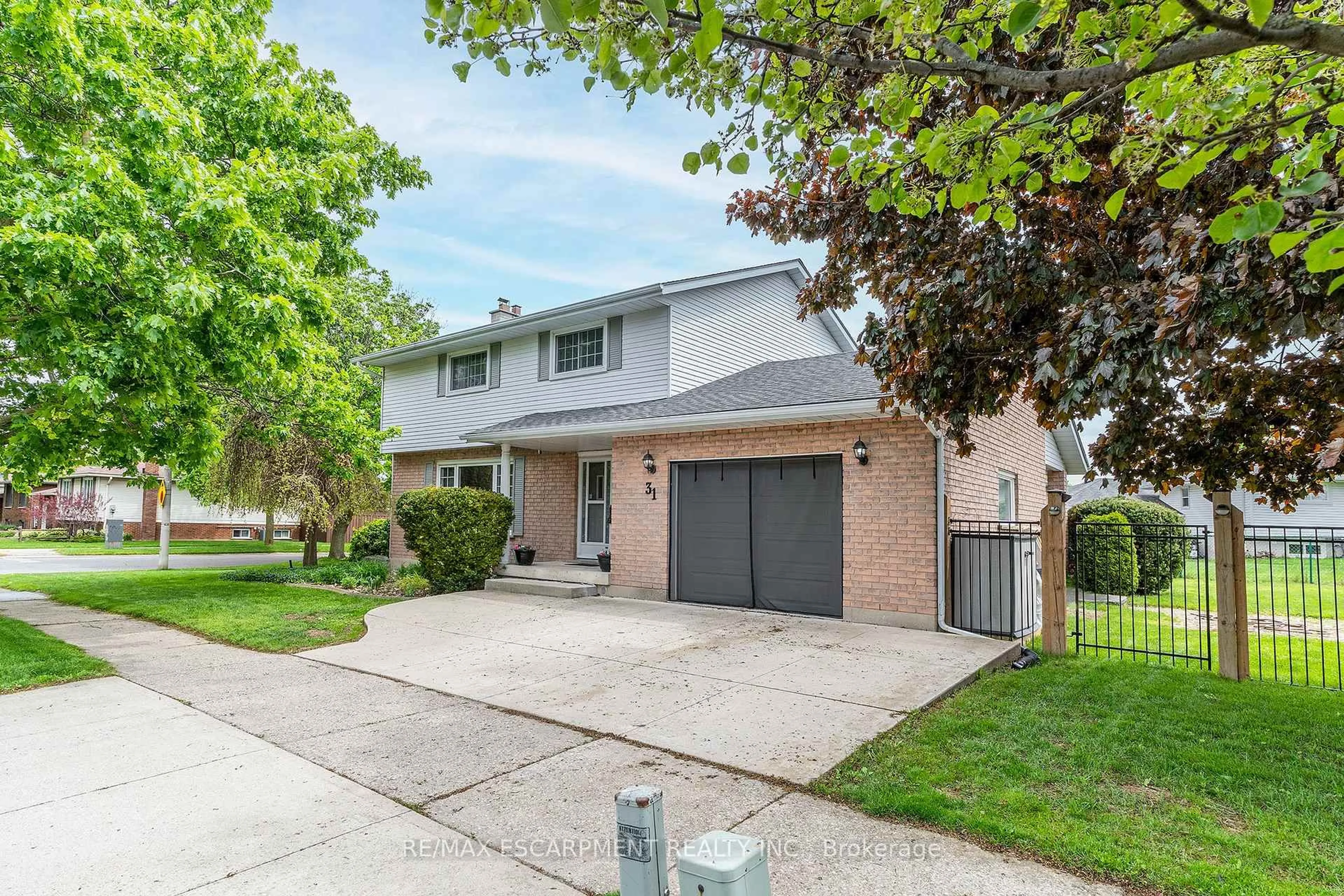 Home with brick exterior material, street for 31 Blackfriar Lane, Brantford Ontario N3R 7M2