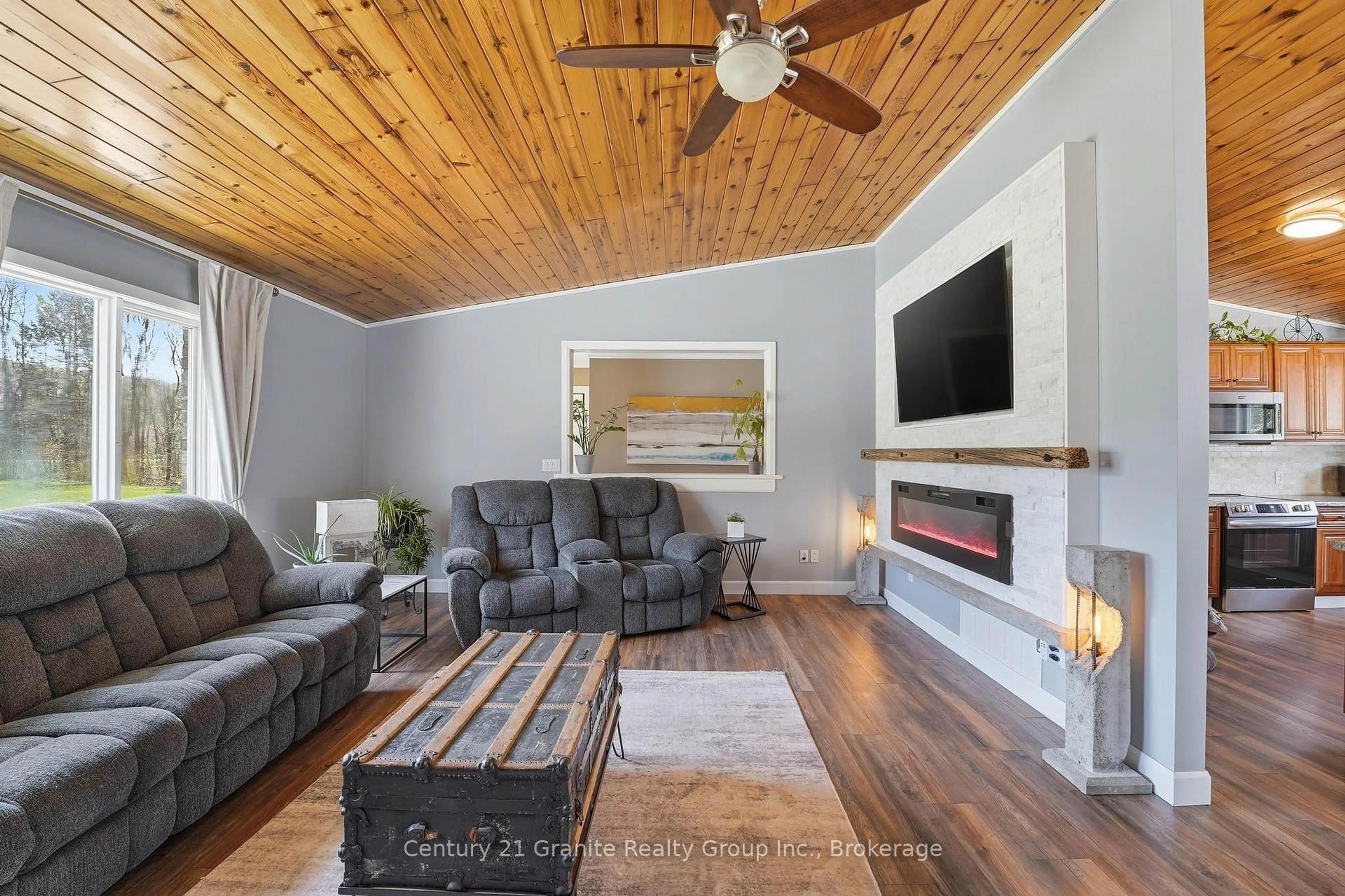 Living room with furniture, wood/laminate floor for 1373 Eagle Lake Rd, Dysart et al Ontario K0M 1S0