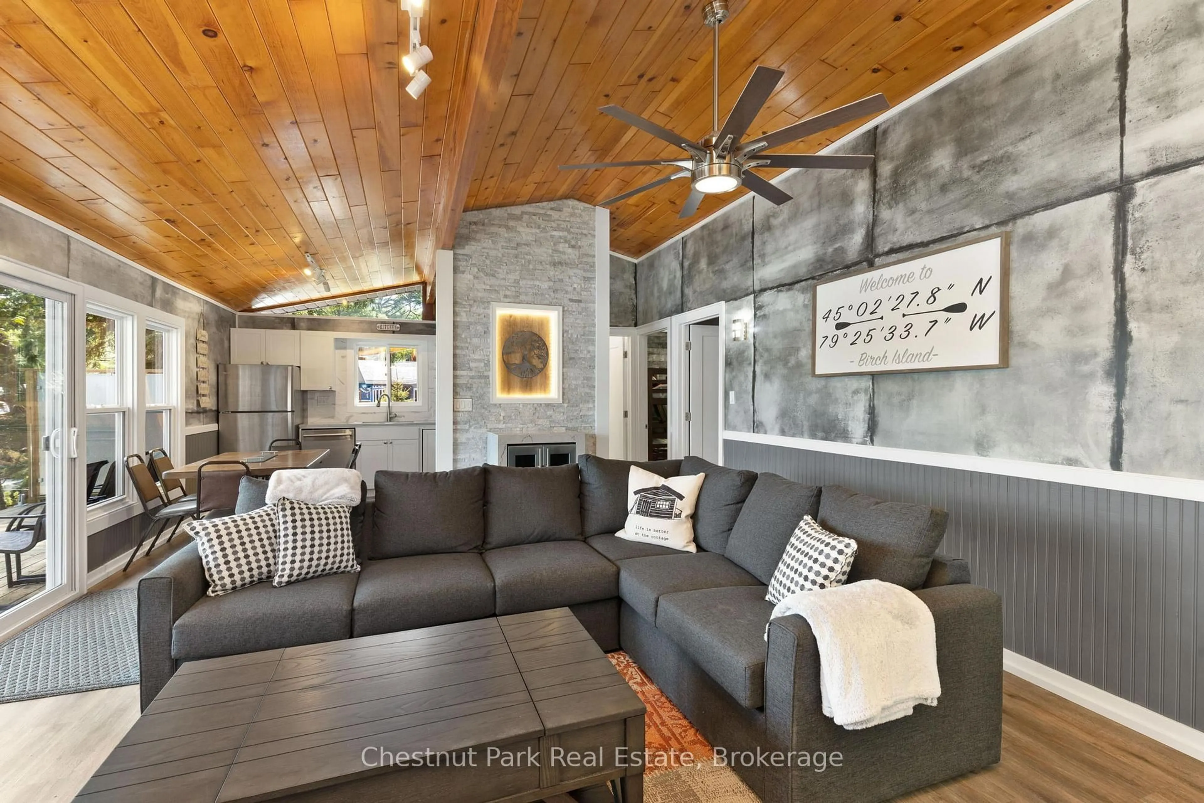 Living room with furniture, cement floor for 76 Birch Island, Bracebridge Ontario P1L 1W8