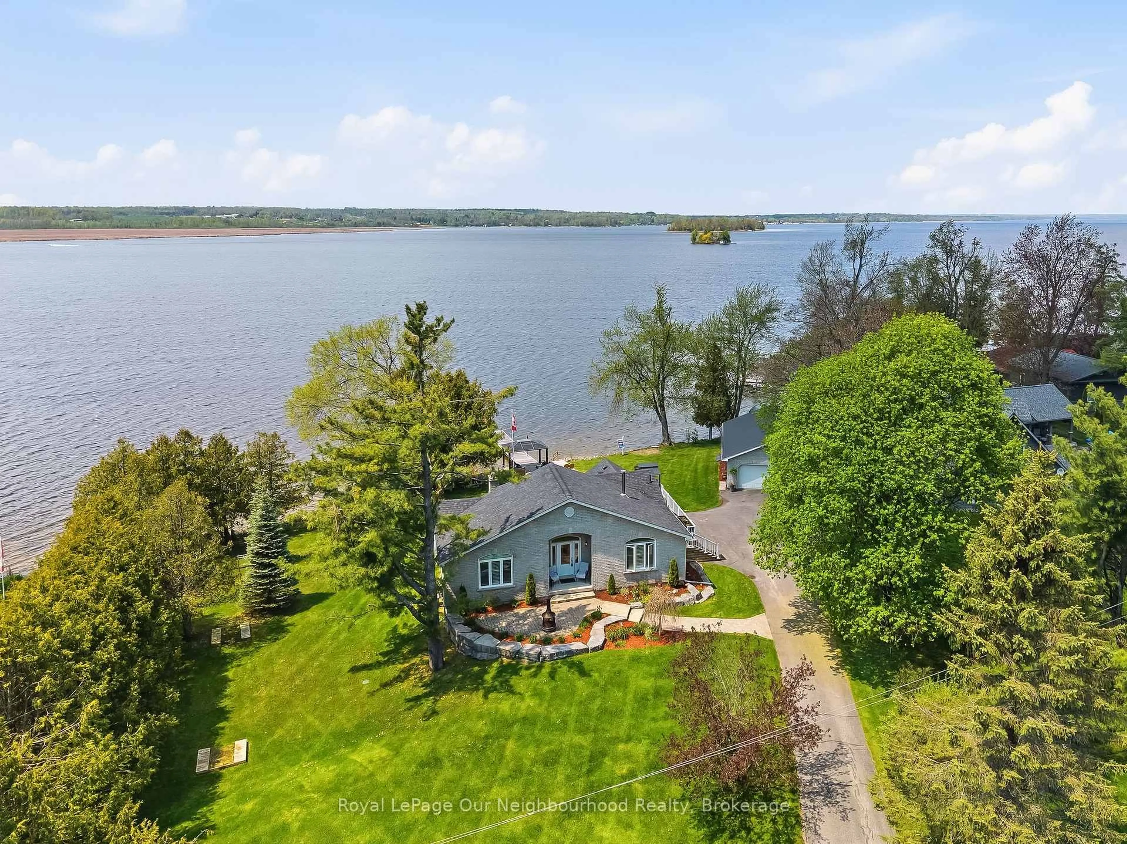 A pic from outside/outdoor area/front of a property/back of a property/a pic from drone, water/lake/river/ocean view for 1354 Island View Dr, Selwyn Ontario K0L 1T0