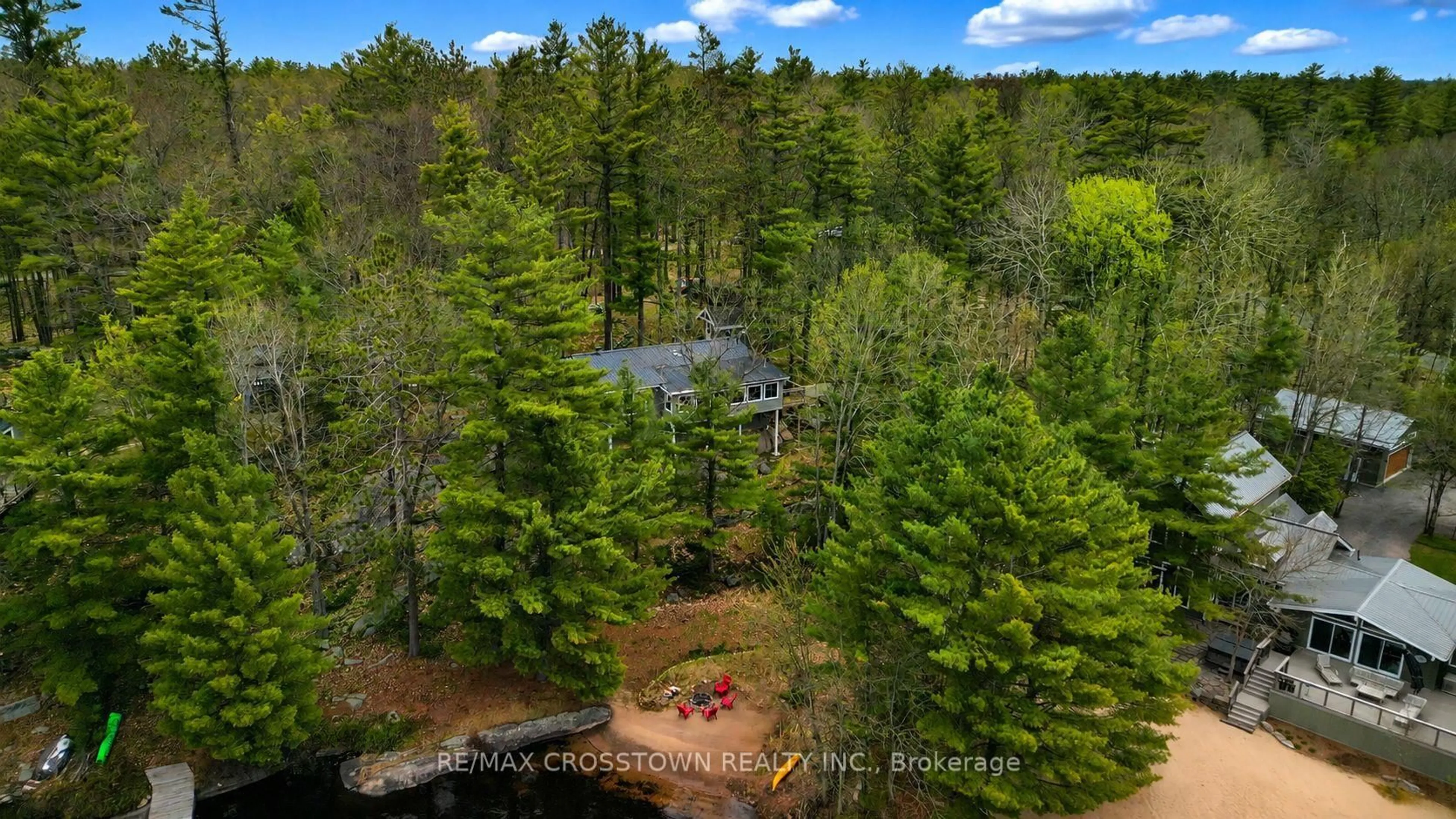 A pic from outside/outdoor area/front of a property/back of a property/a pic from drone, forest/trees view for 607 Juniper Dr, Gravenhurst Ontario P1P 1R1