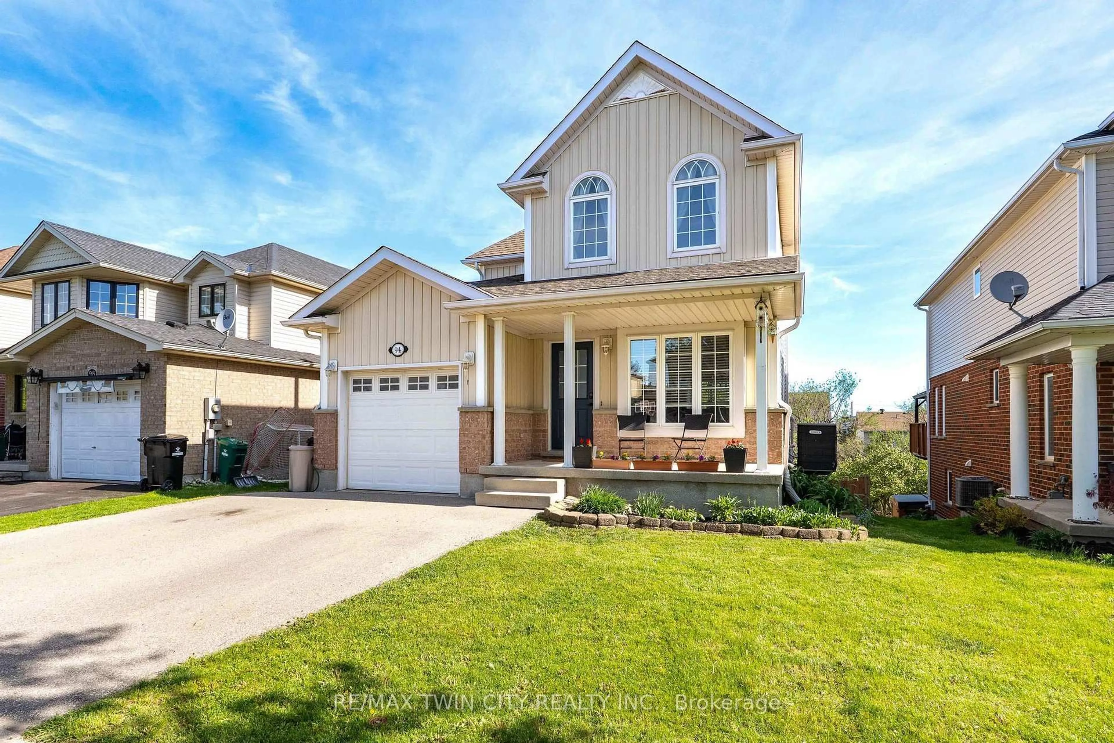 Home with vinyl exterior material, street for 94 Porchlight Dr, Woolwich Ontario N3B 3M8