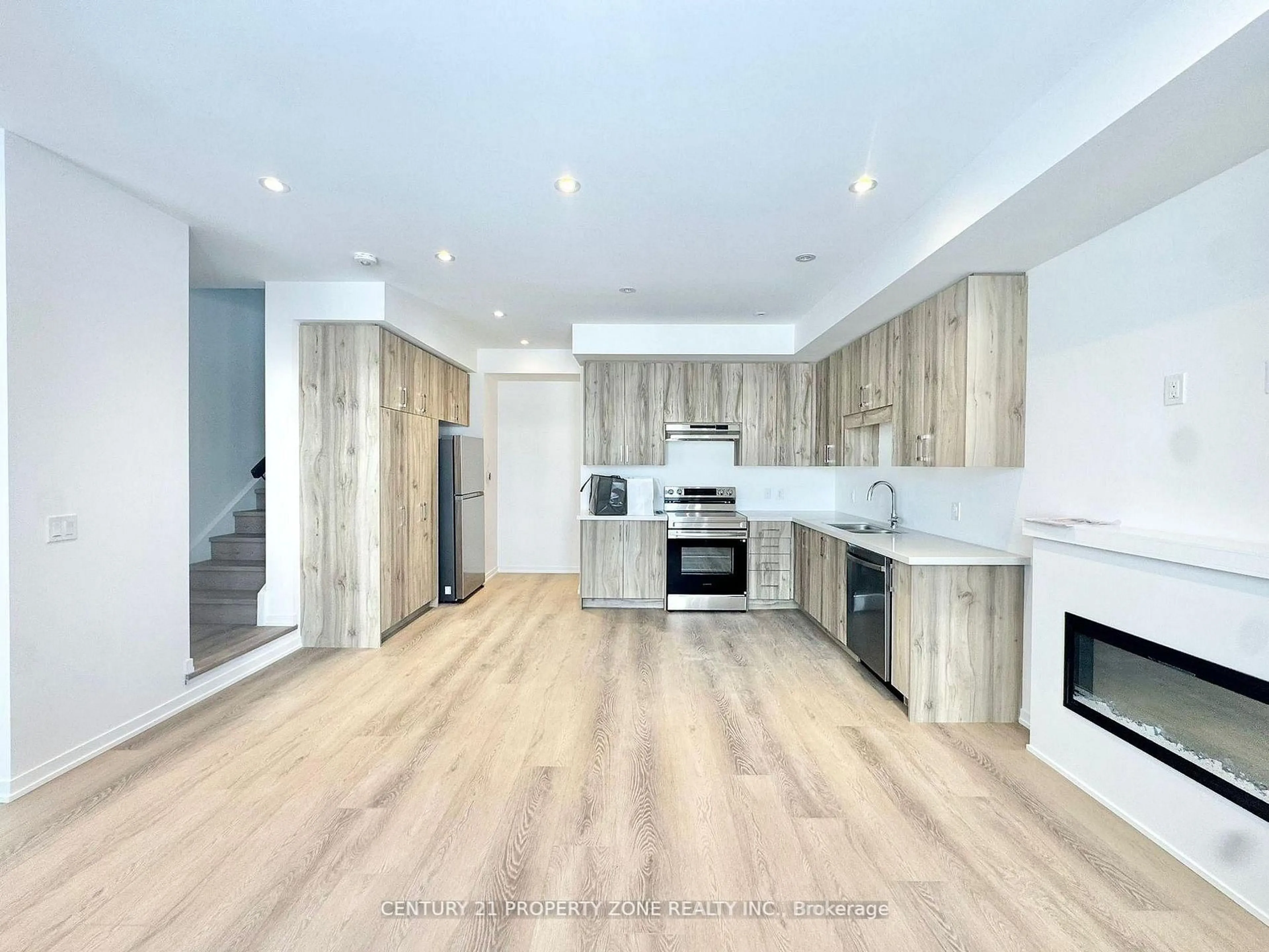 Open concept kitchen, wood/laminate floor for 49 Kingbird Common, Cambridge Ontario N1R 5S2